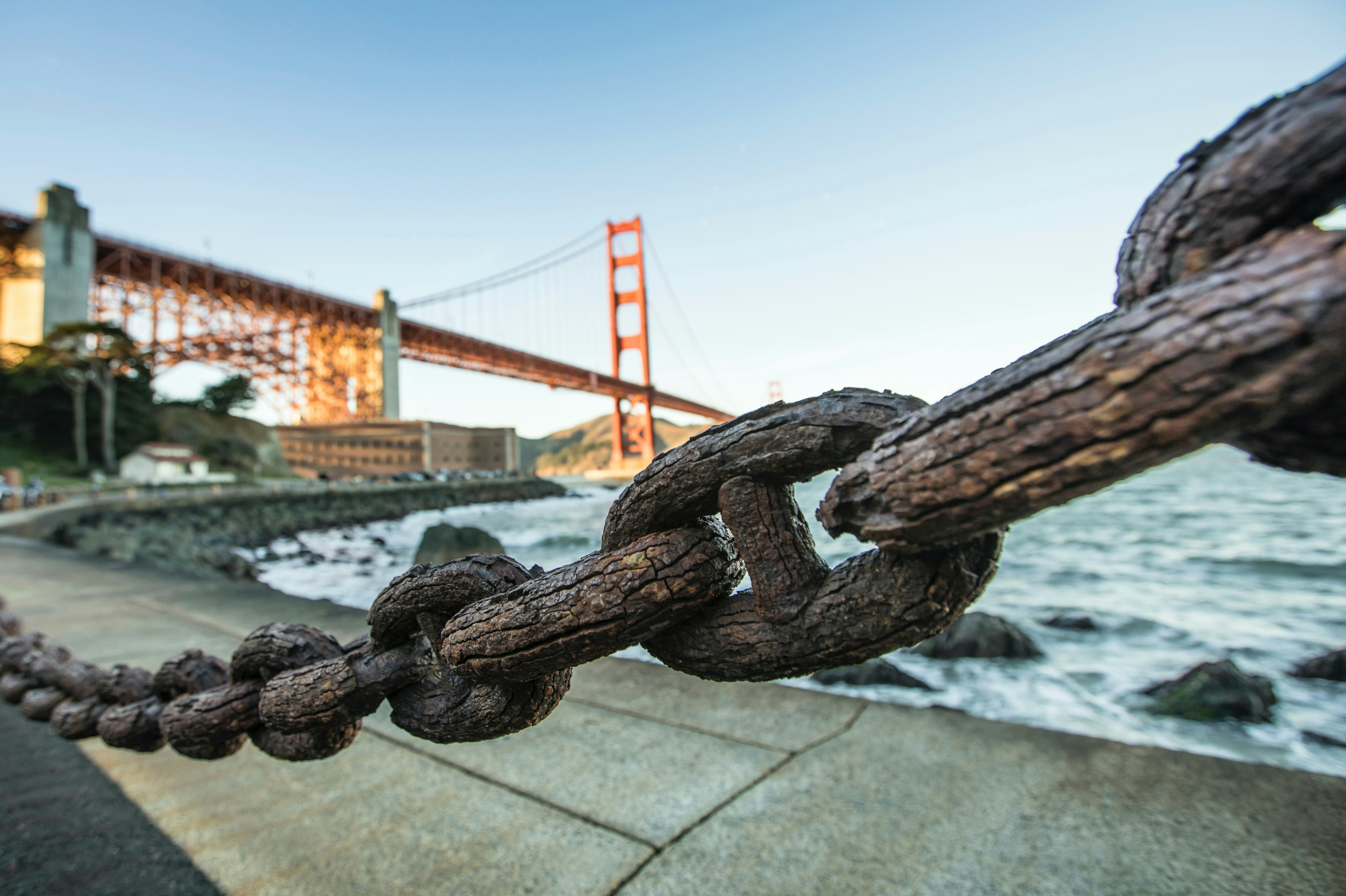 Rusty anchor chain in front of the golden gate bridge