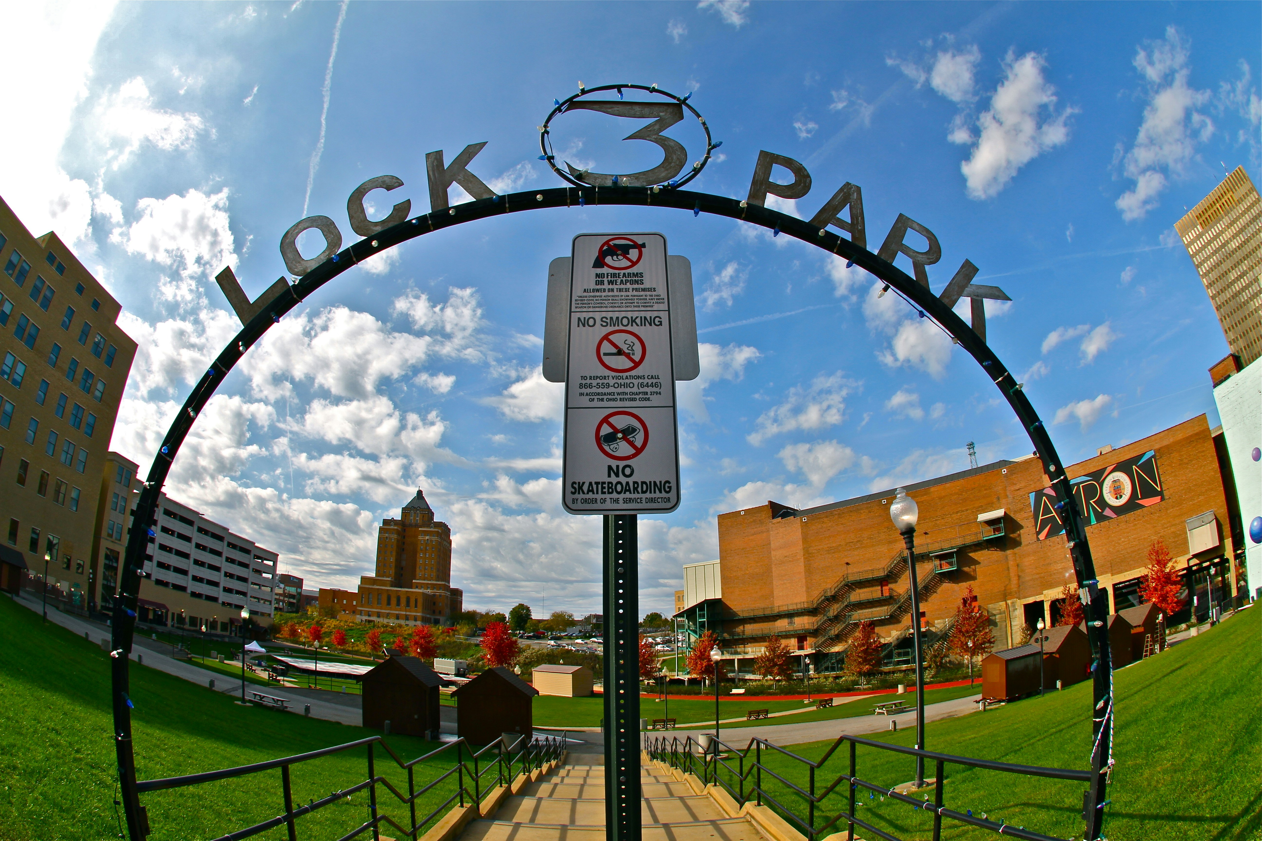 Lock 3 park entrance with city buildings in background