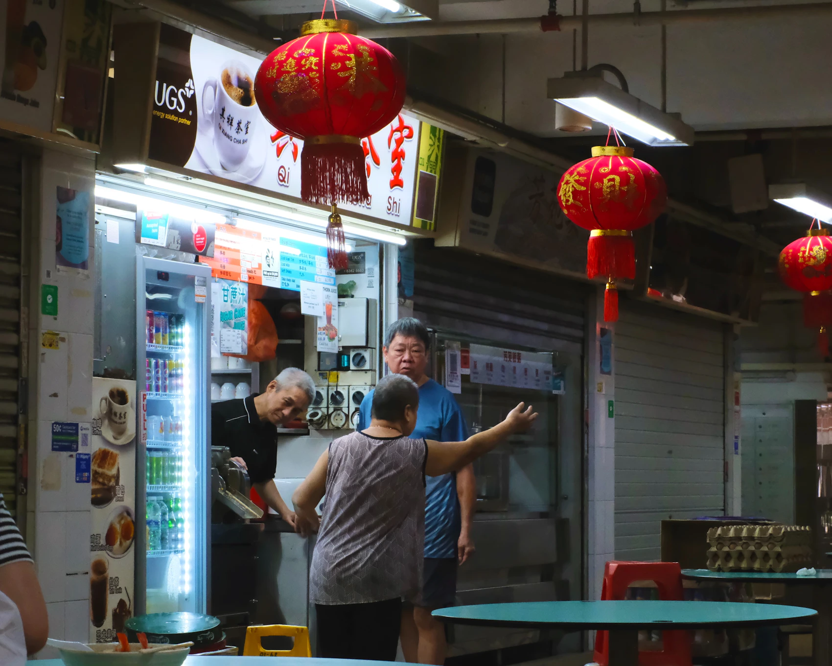 People gathered around a traditional drinks stall in Hong Lim Food Centre