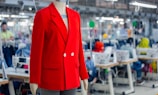 Red blazer on mannequin in a factory setting