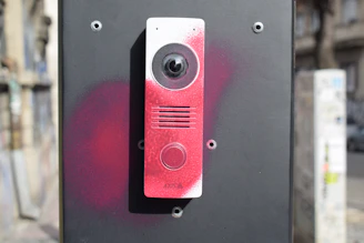Intercom device with red spray paint markings
