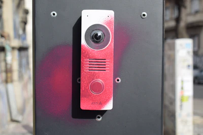 Intercom device with red spray paint markings
