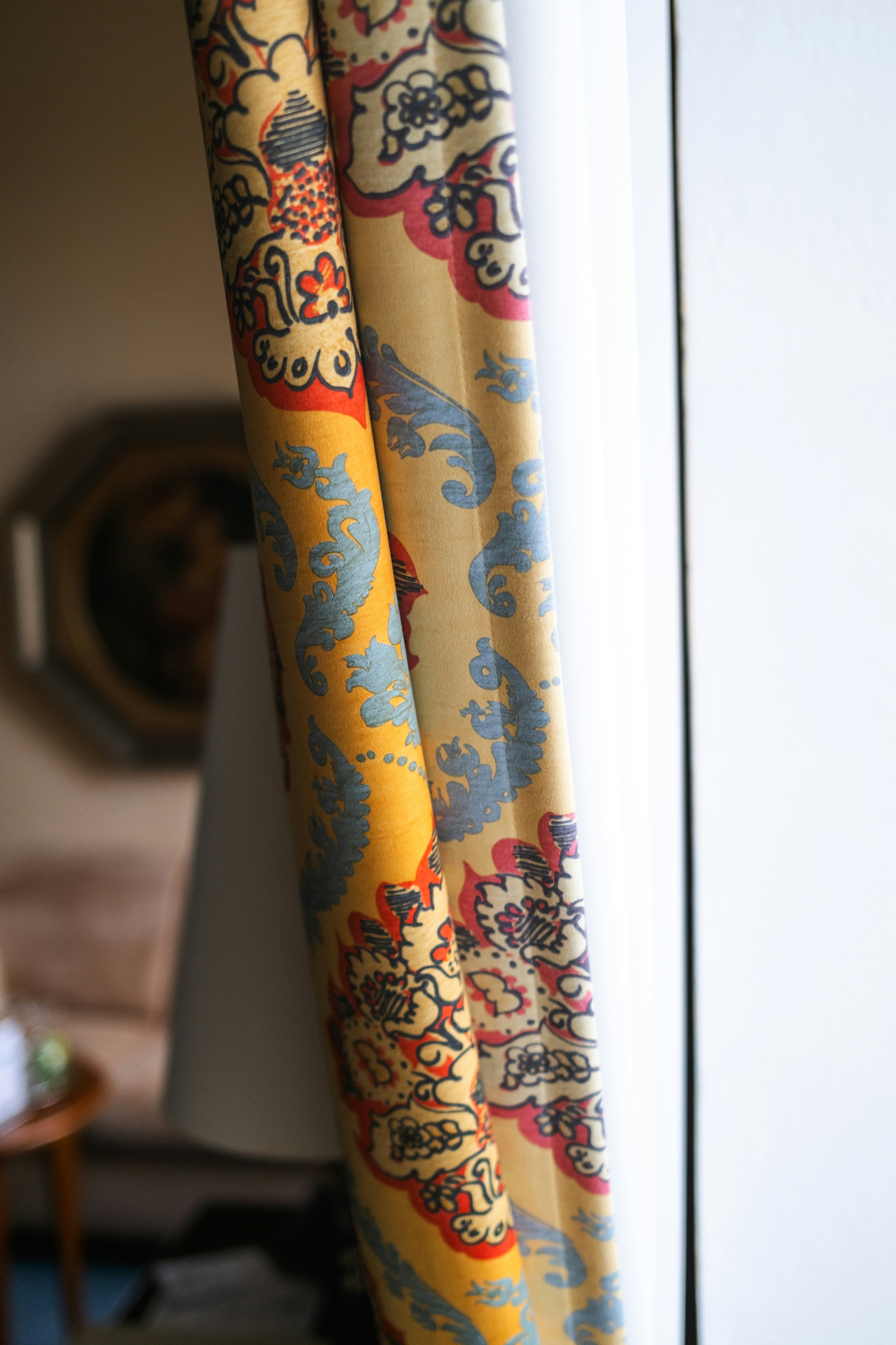Close-up of decorative curtains with intricate patterns.