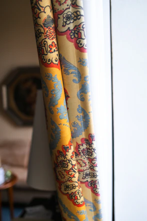Close-up of decorative curtains with intricate patterns.