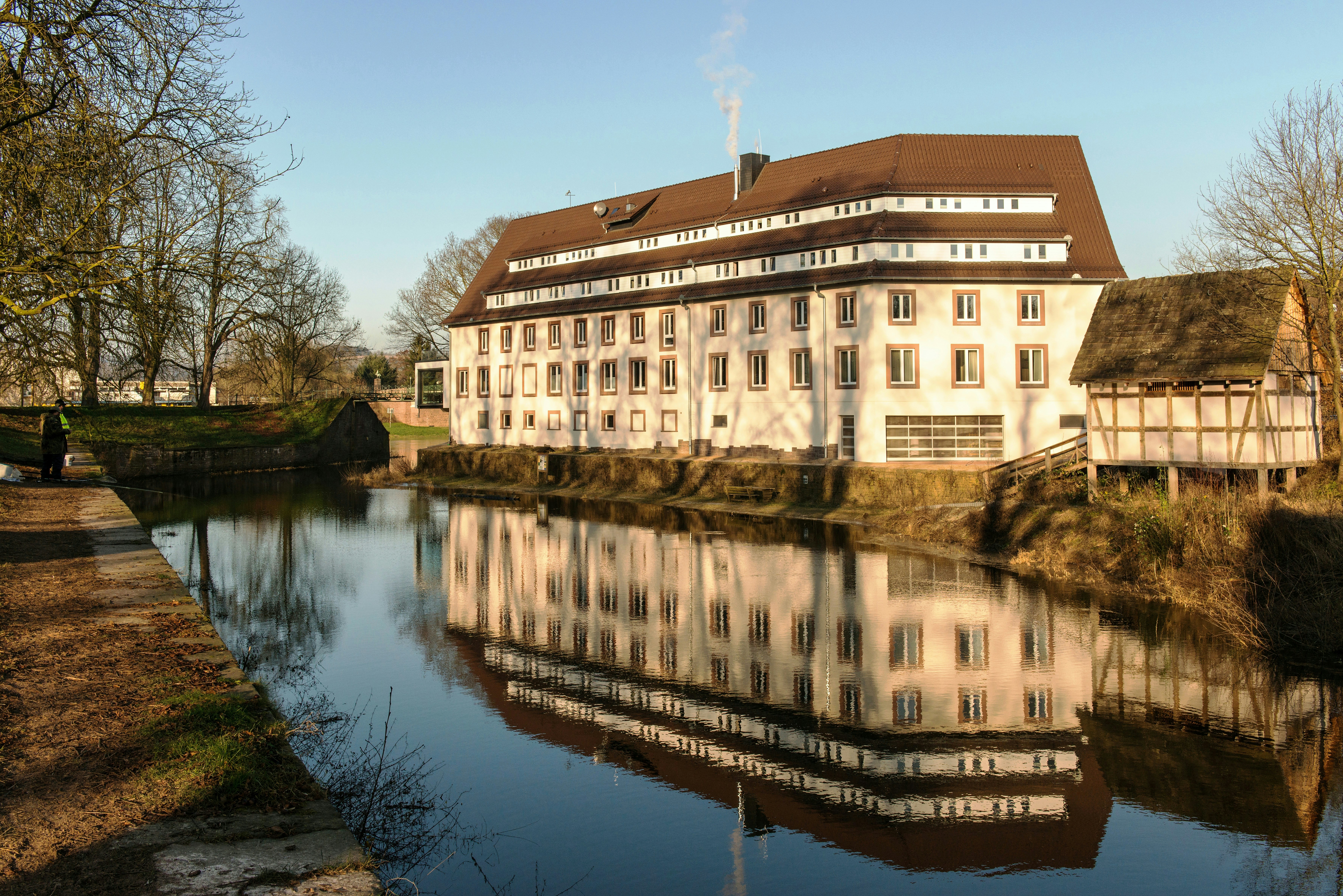 Historic building reflected in calm water