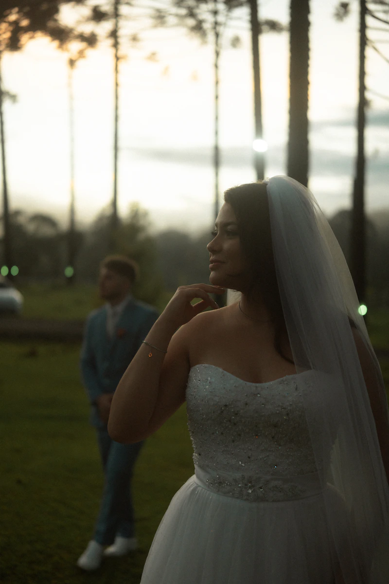 Bride in a flowing white wedding dress with her groom