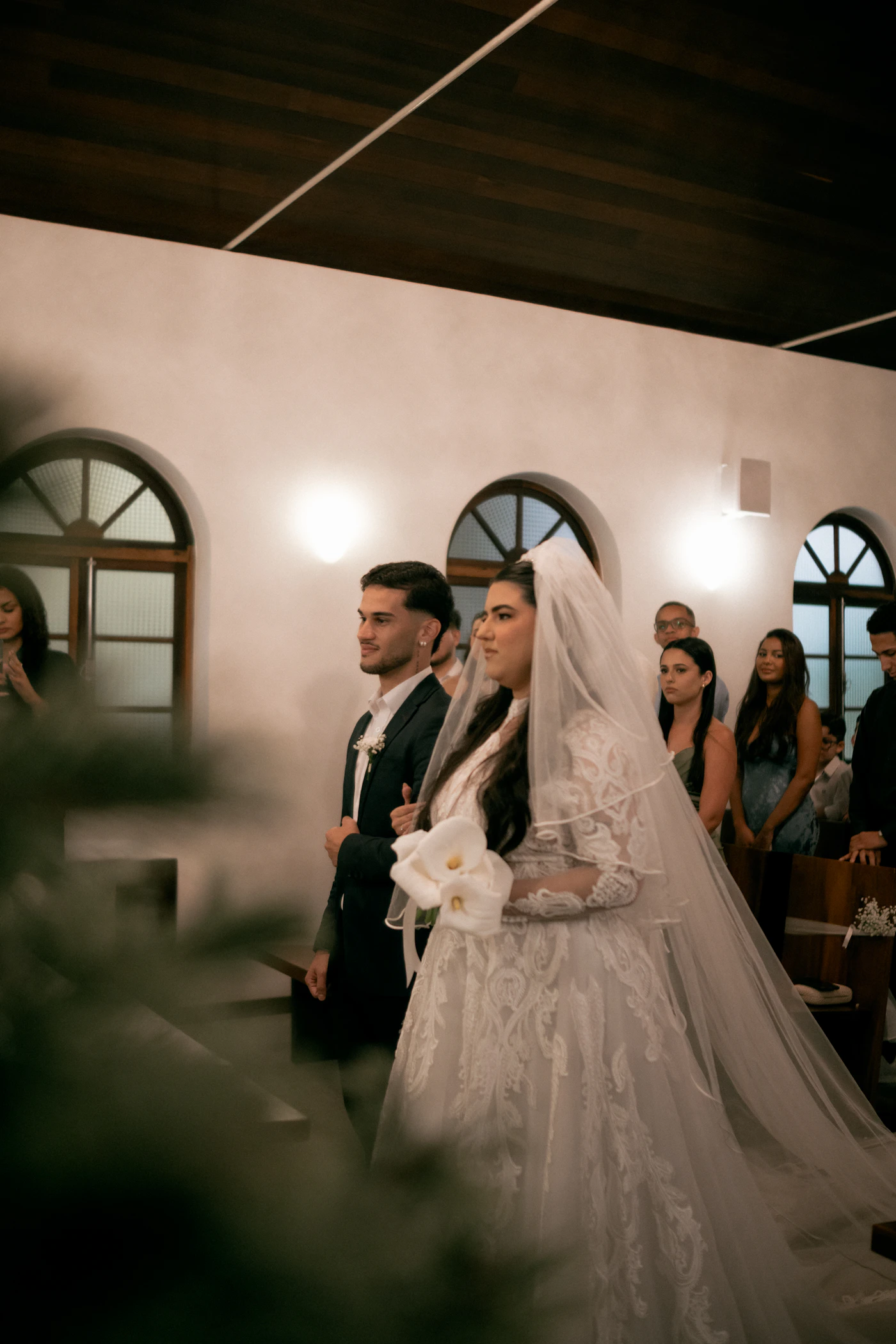 Bride and groom walking down the wedding ceremony aisle together in an emotional and dramatic moment