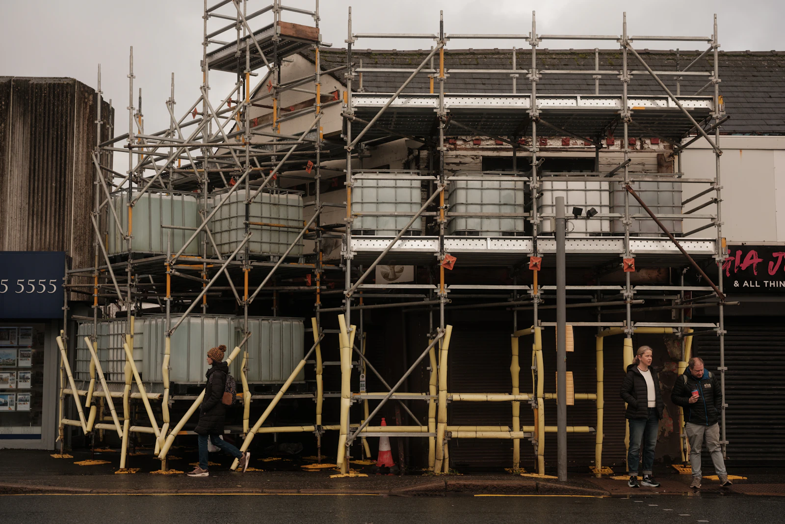 Commercial building exterior with scaffolding during renovation