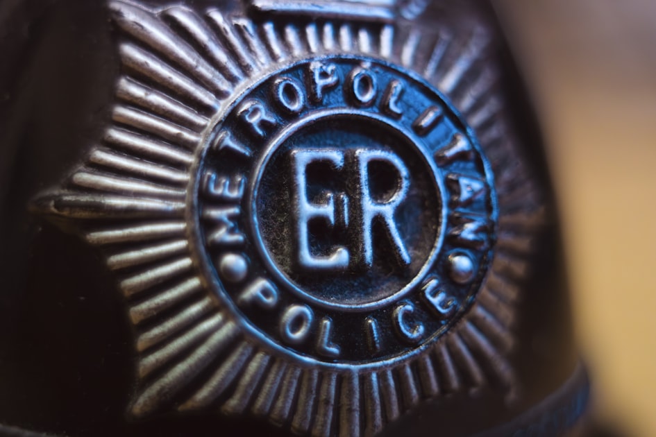 Close-up of a metropolitan police badge