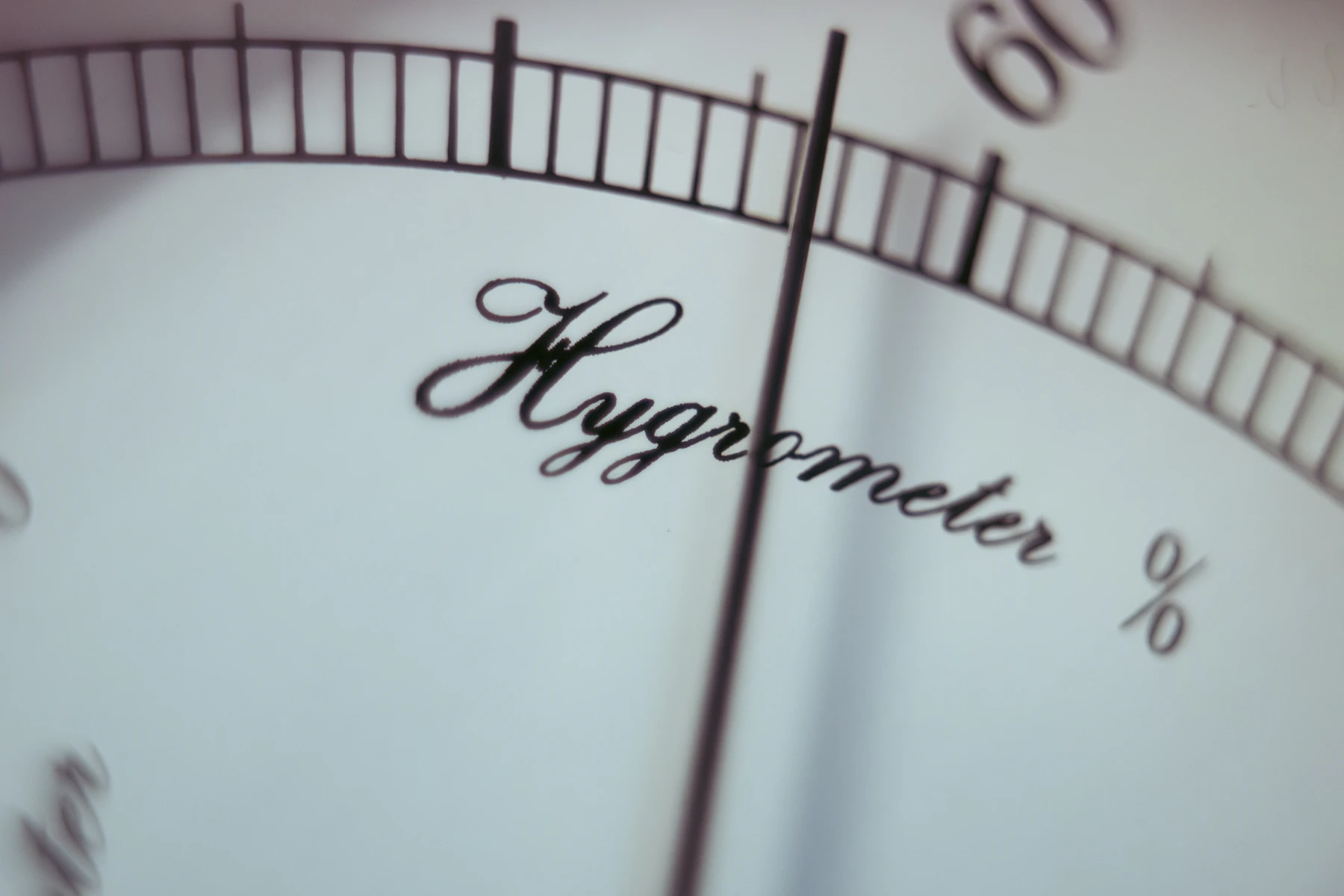 Close-up of a hygrometer dial used to monitor indoor relative humidity