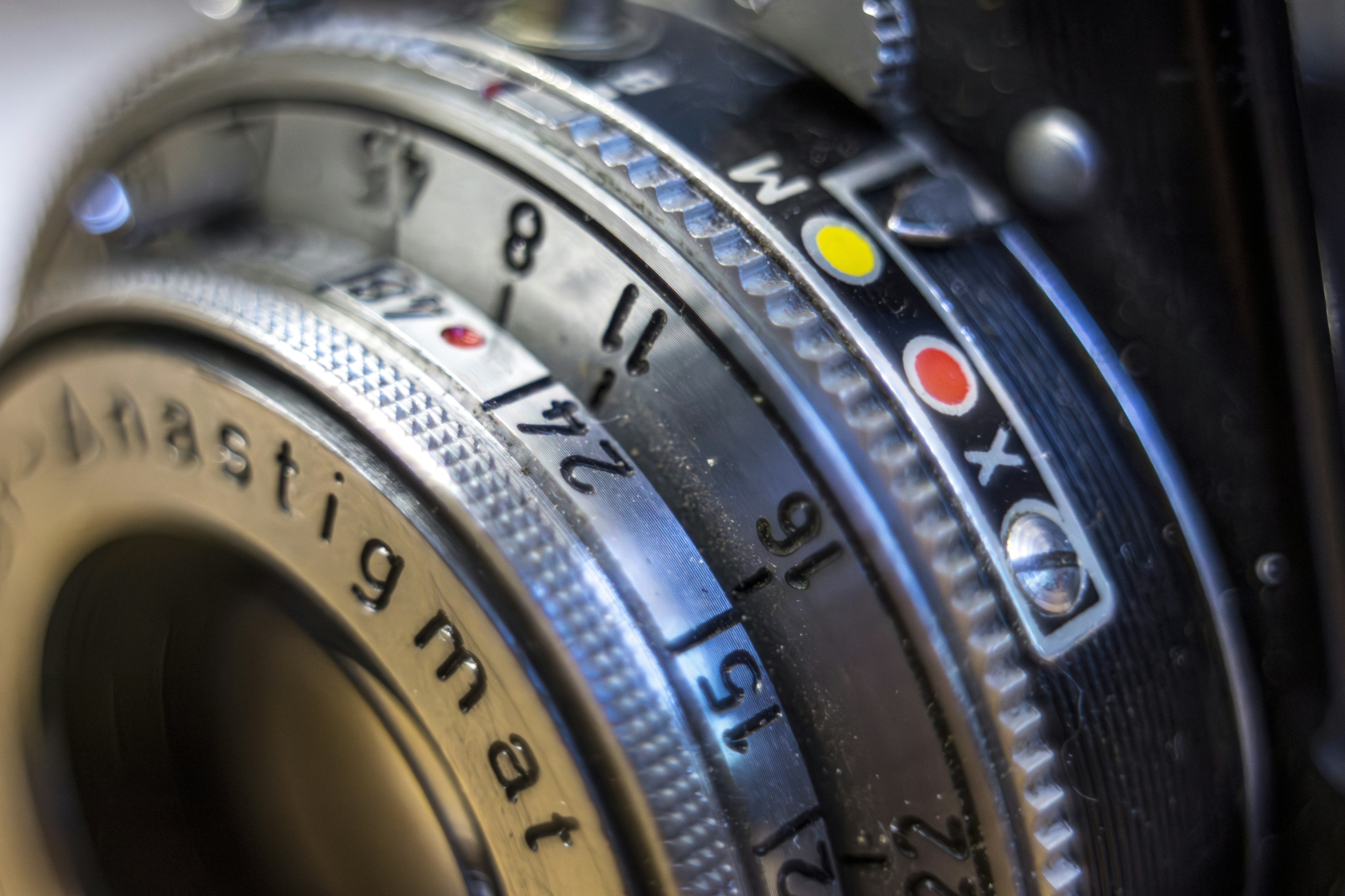 Close-up of an old camera lens aperture settings