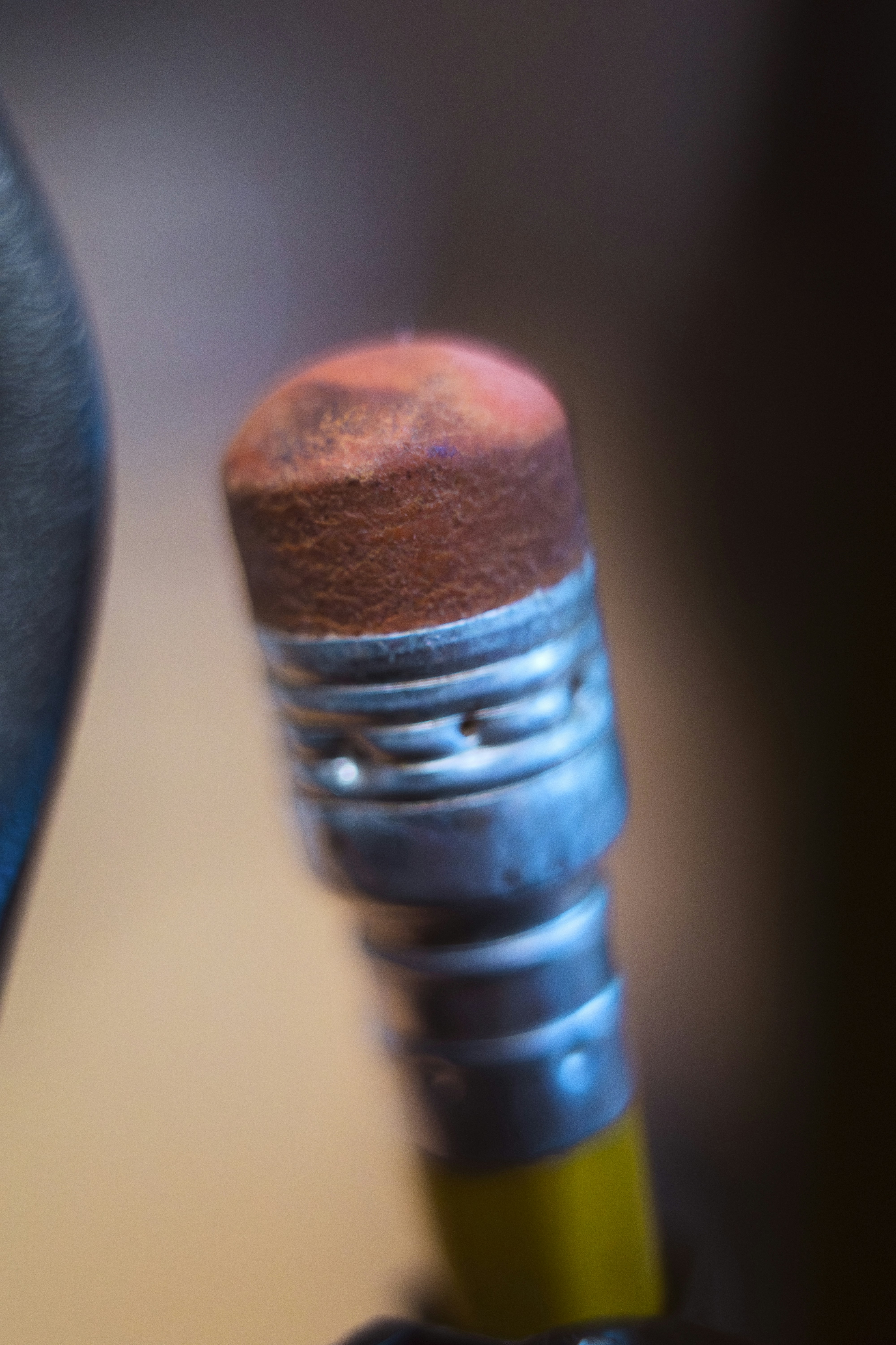 Close-up of a pencil eraser with a metal ferrule.