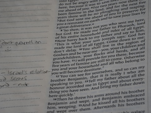 Close-up of an open bible with handwritten notes.