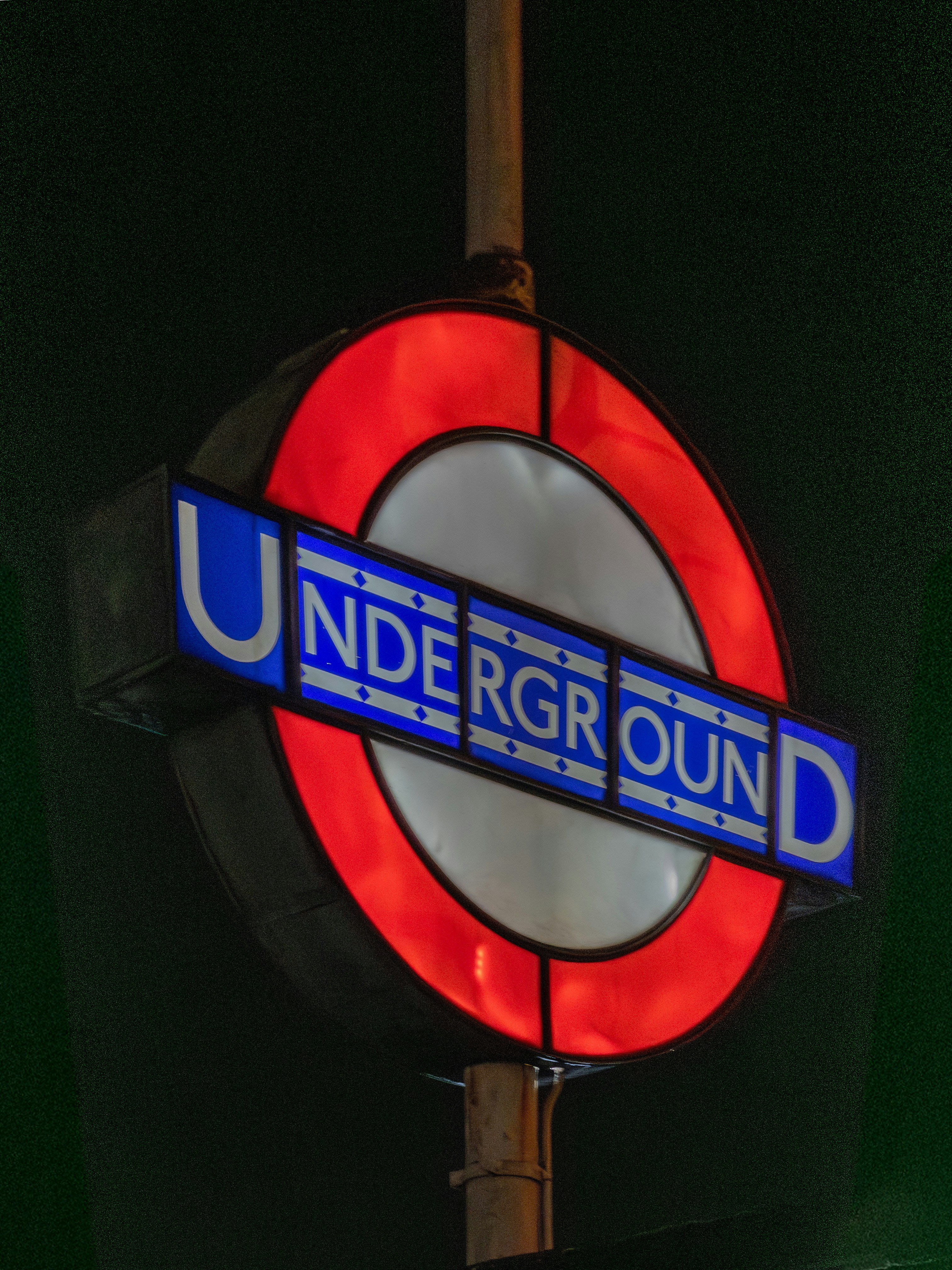 London underground sign at night