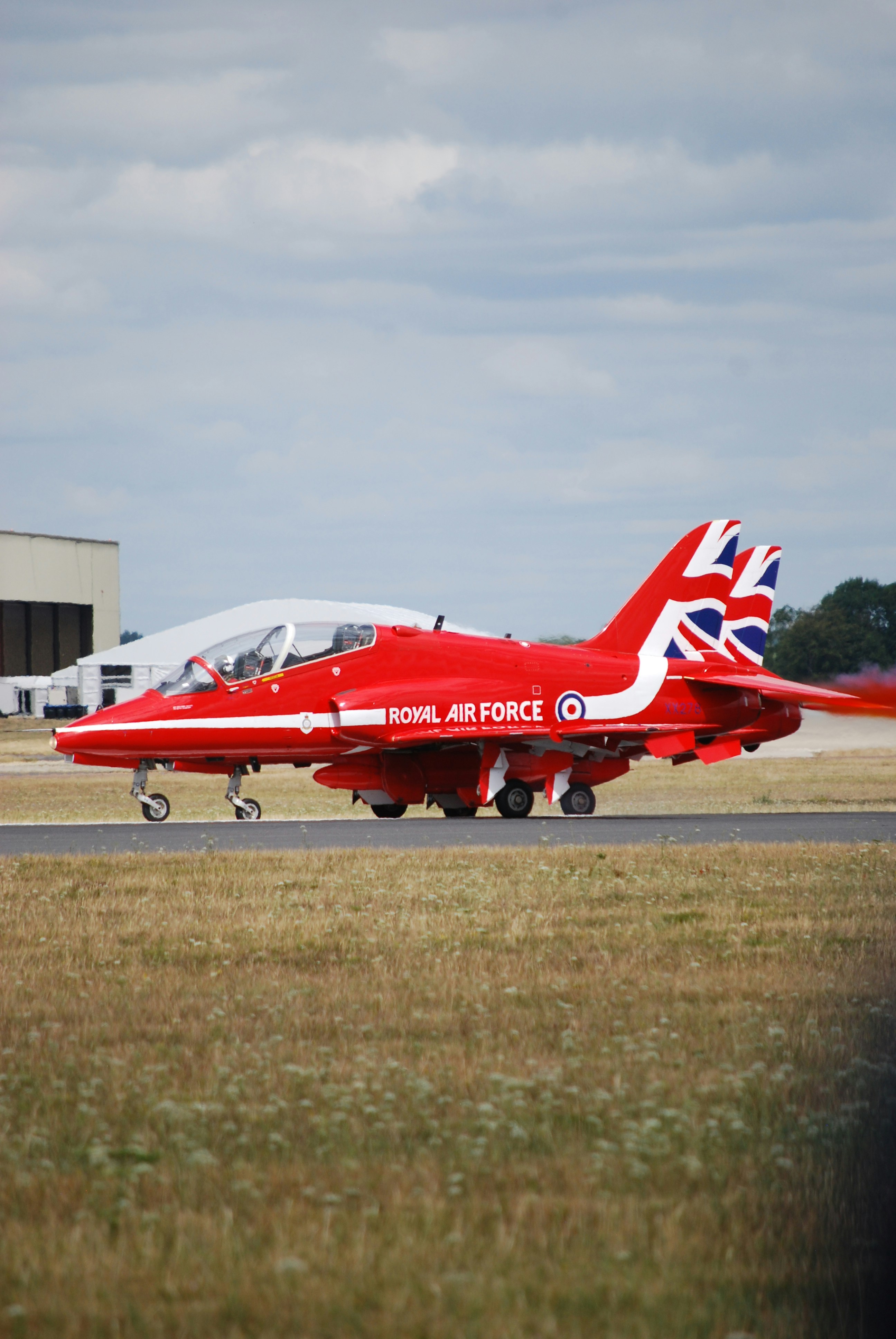 Red royal air force jet on tarmac