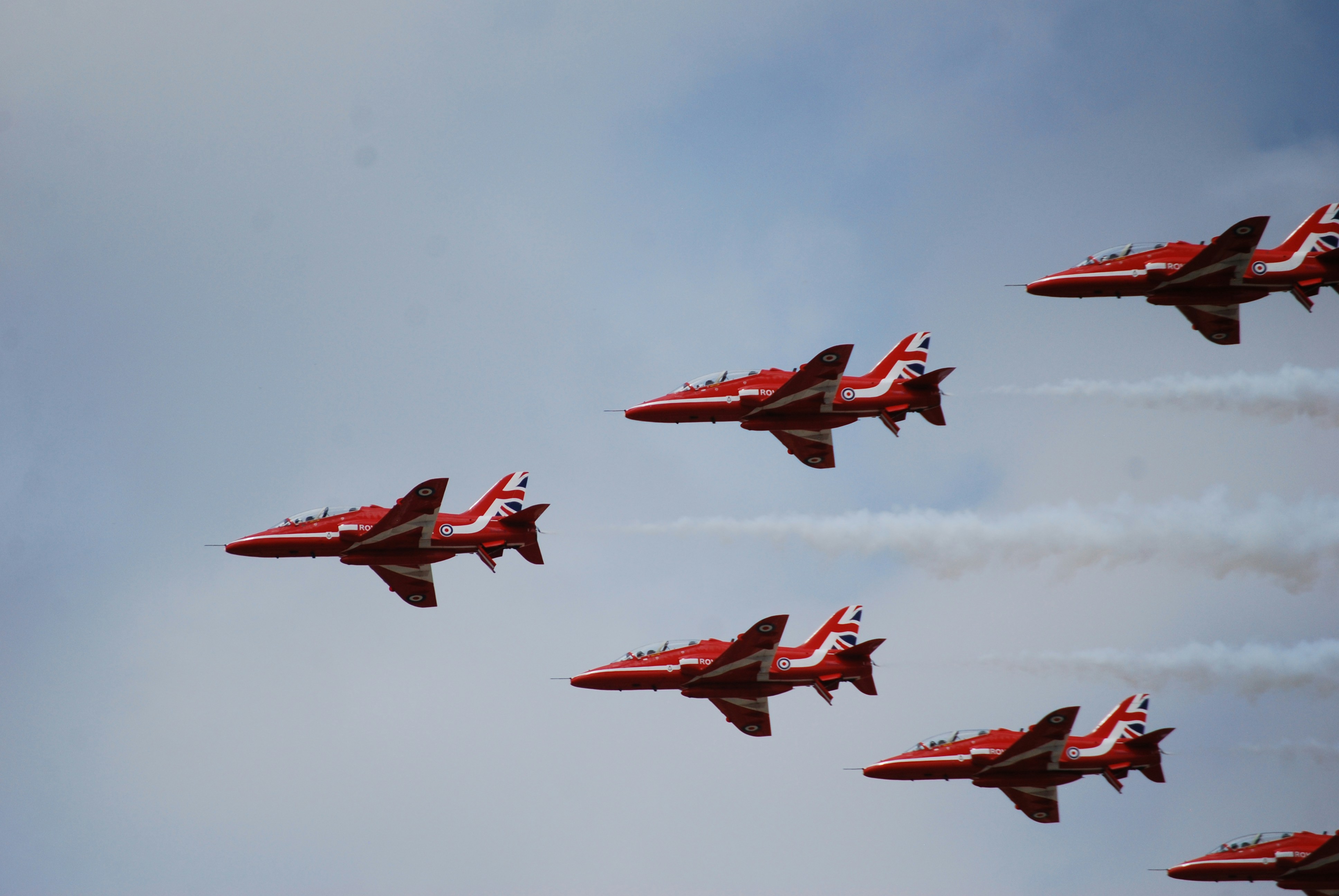 Red arrows display team flying in formation