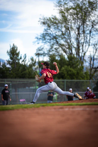 Baseball pitcher throwing a ball during a game.