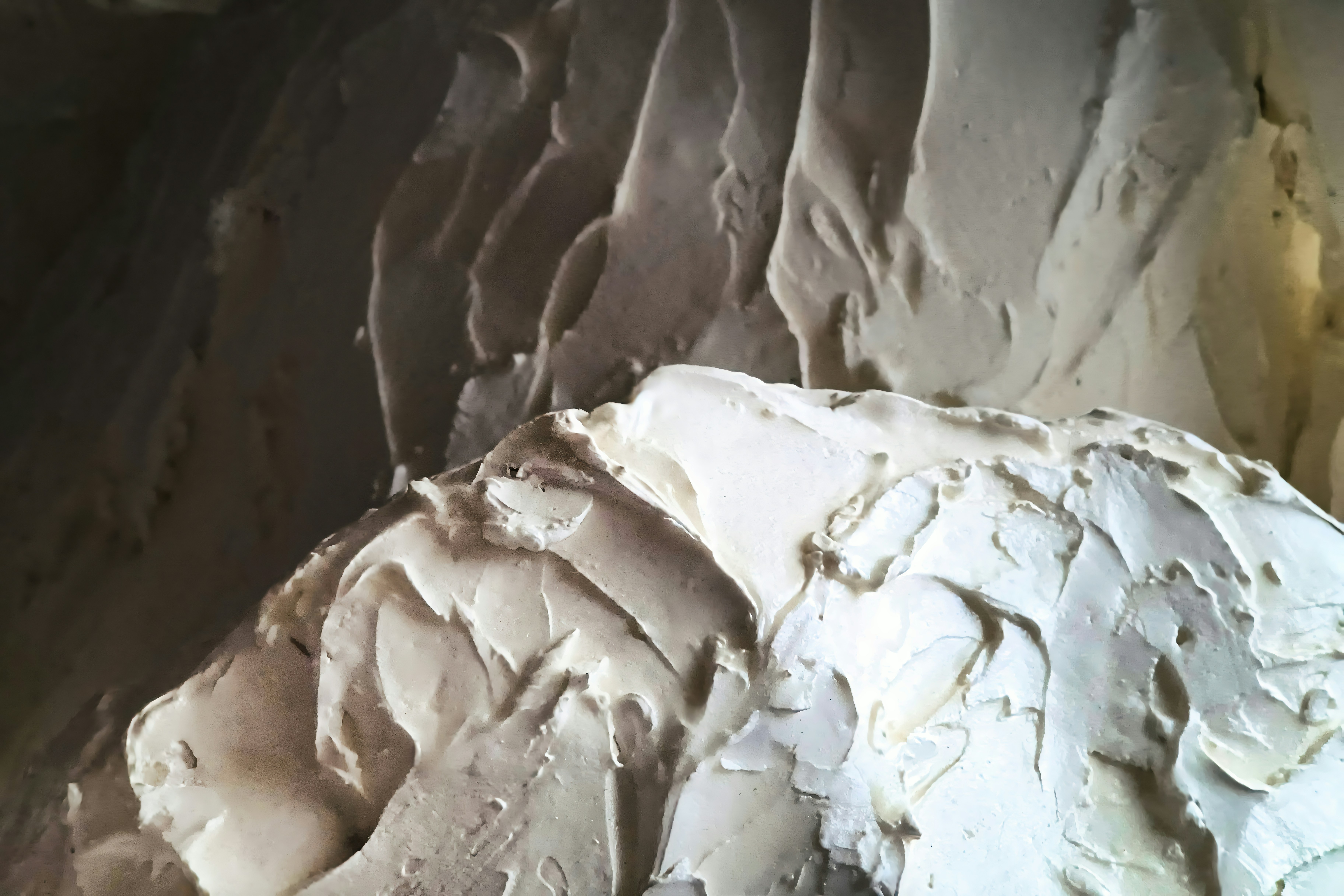 Close-up of textured beige and white material.