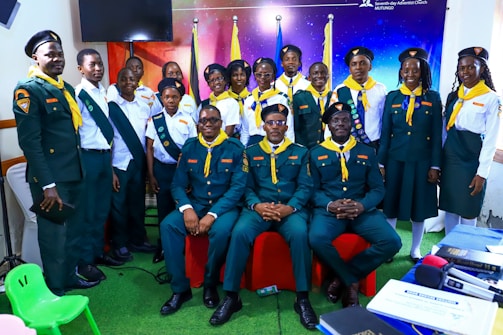 Group of people in scout uniforms posing for an event.
