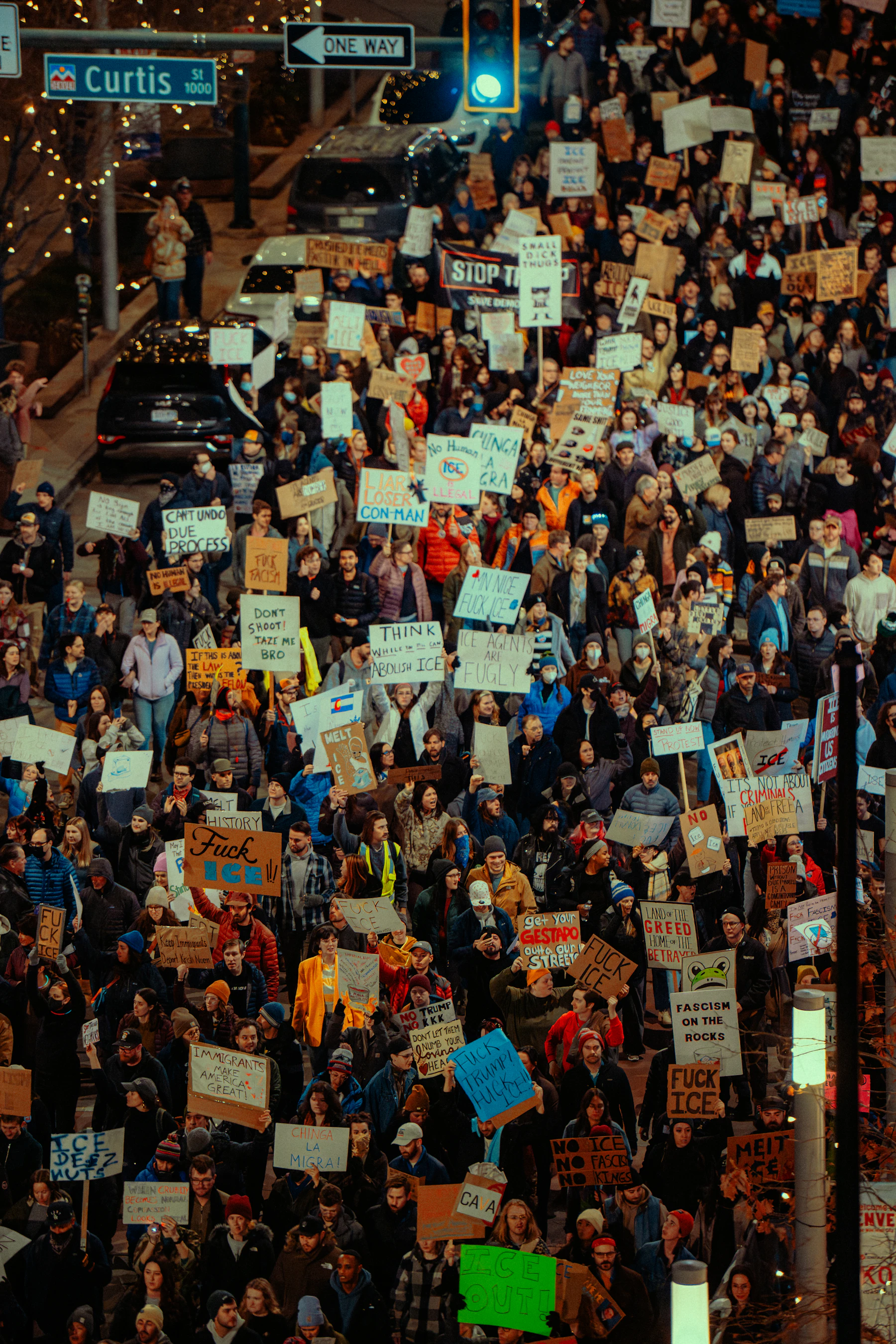 Crowd holding signs at a protest