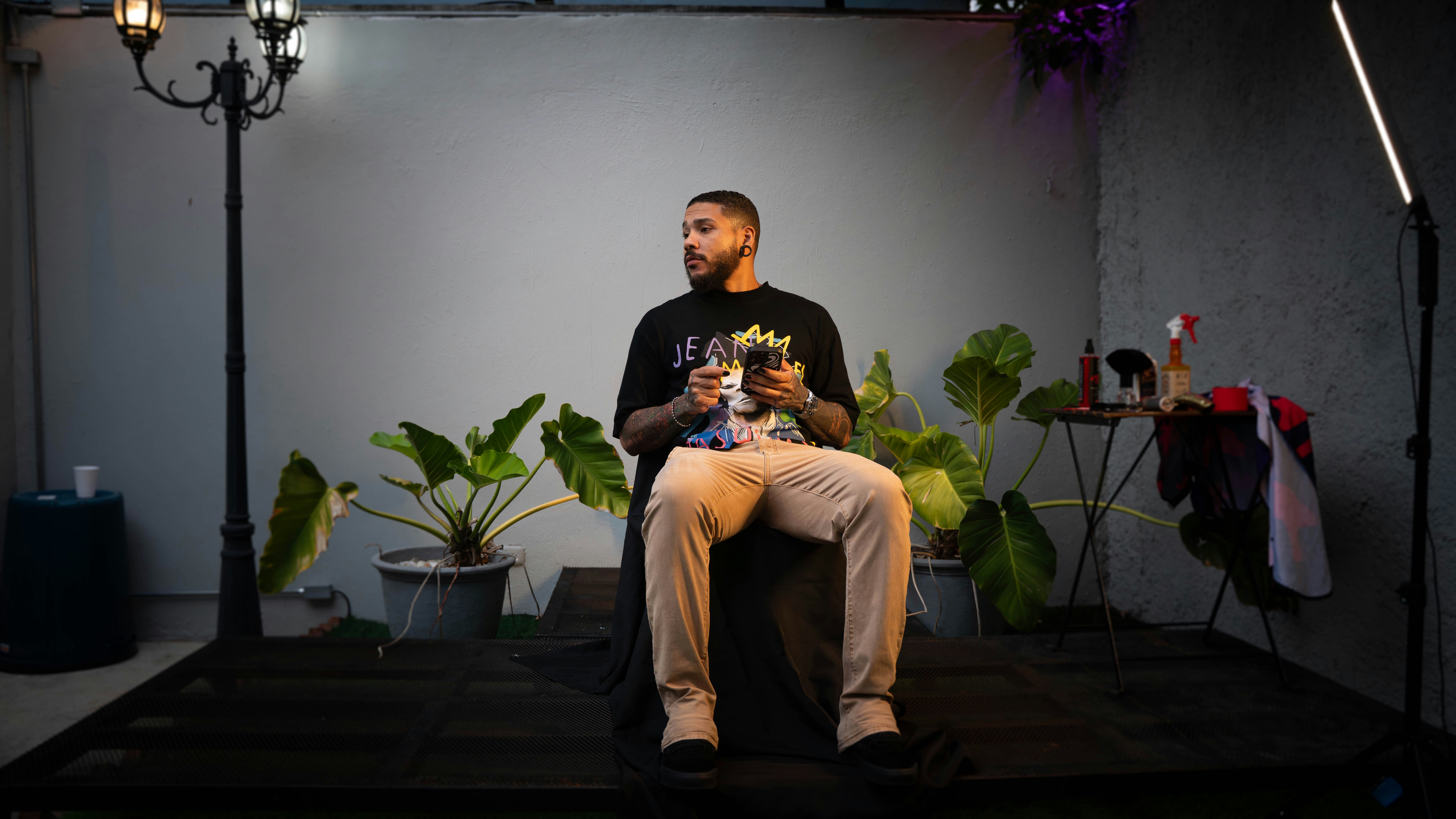 Man sitting with flowers and drinks