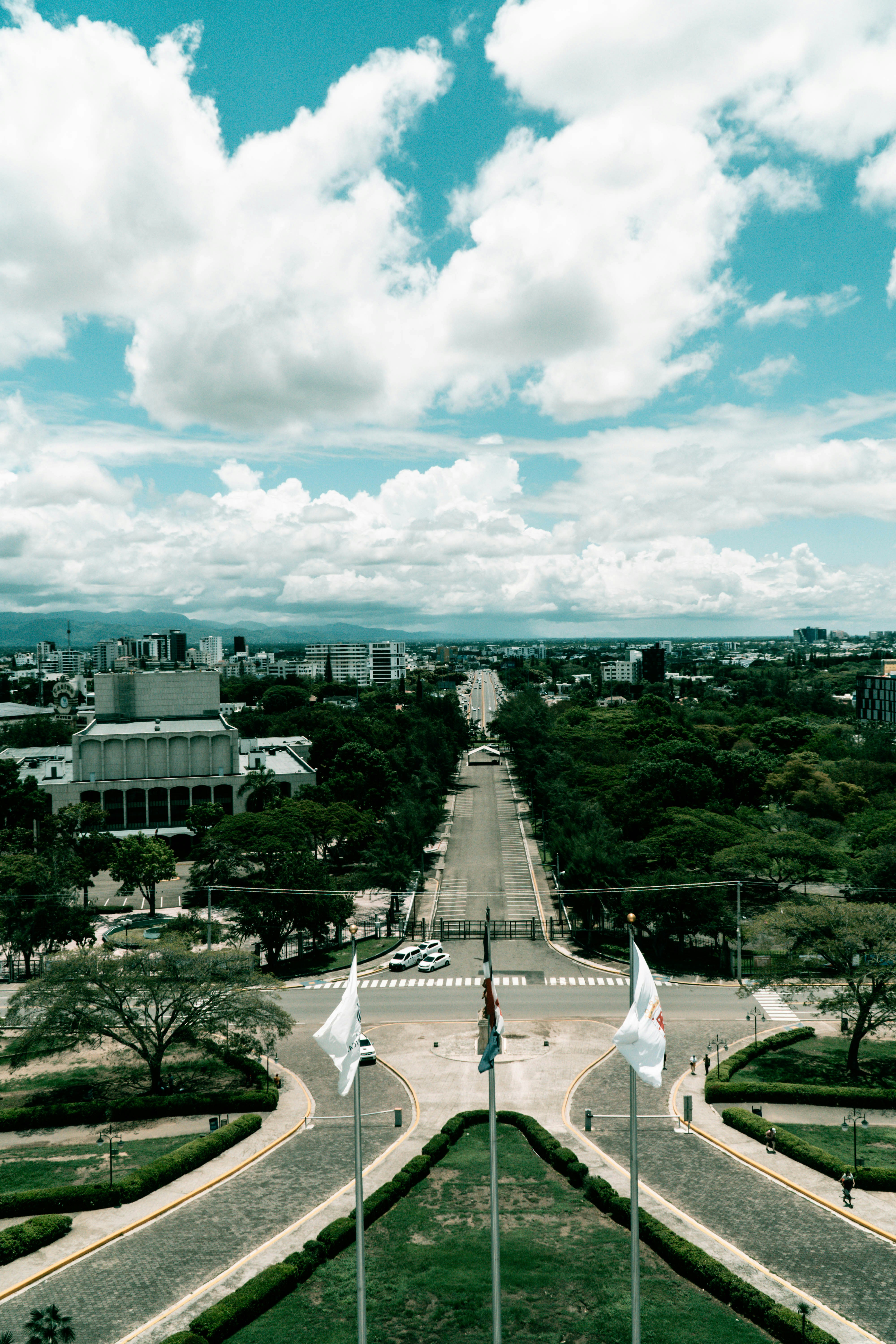 Wide avenue leading to a distant city skyline.