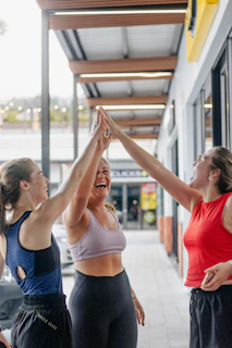 Three women giving each other a high five