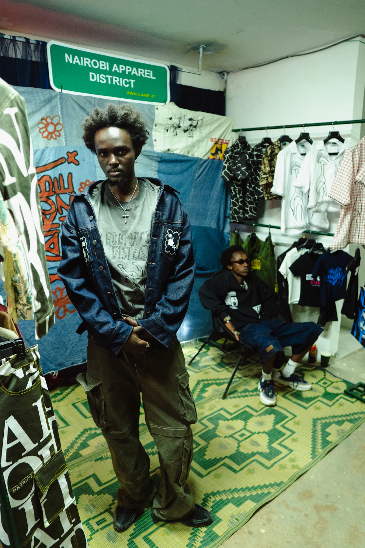 Two people inside an African apparel shop