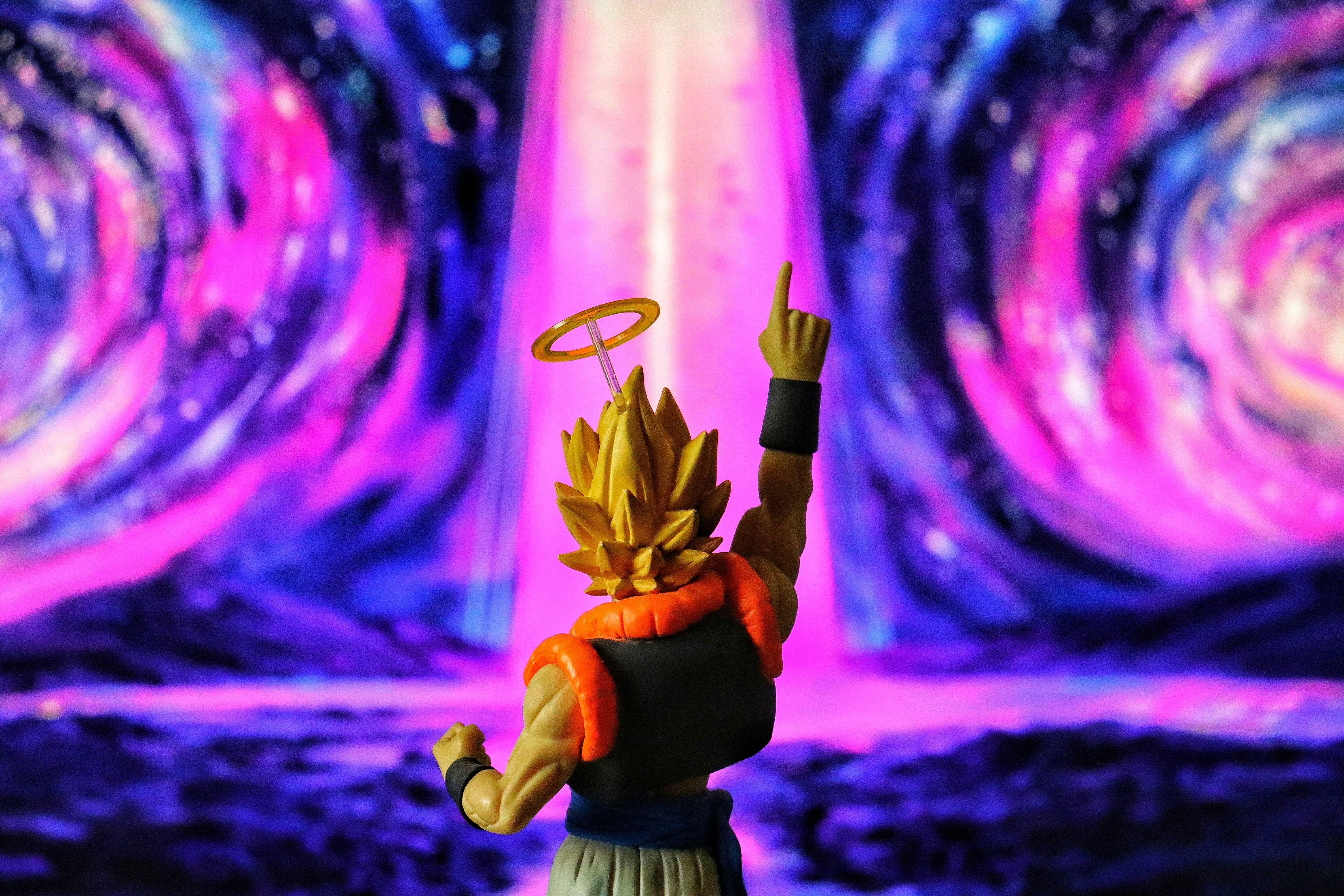 Anime character with halo points to purple cosmic background