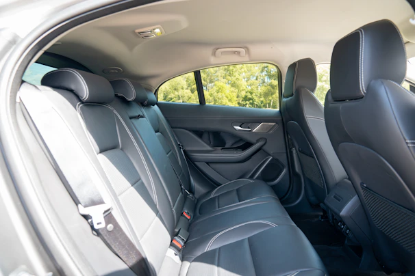 Black leather car seats in the back row.