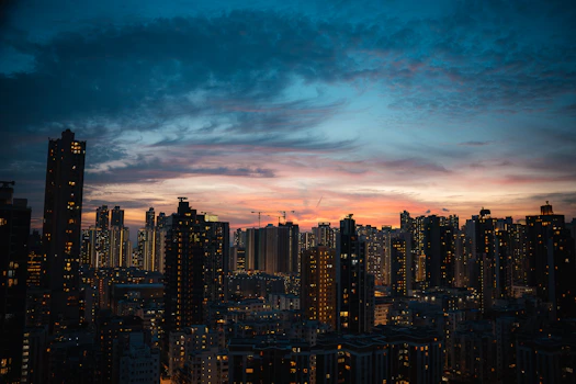 City skyline at dusk with illuminated buildings
