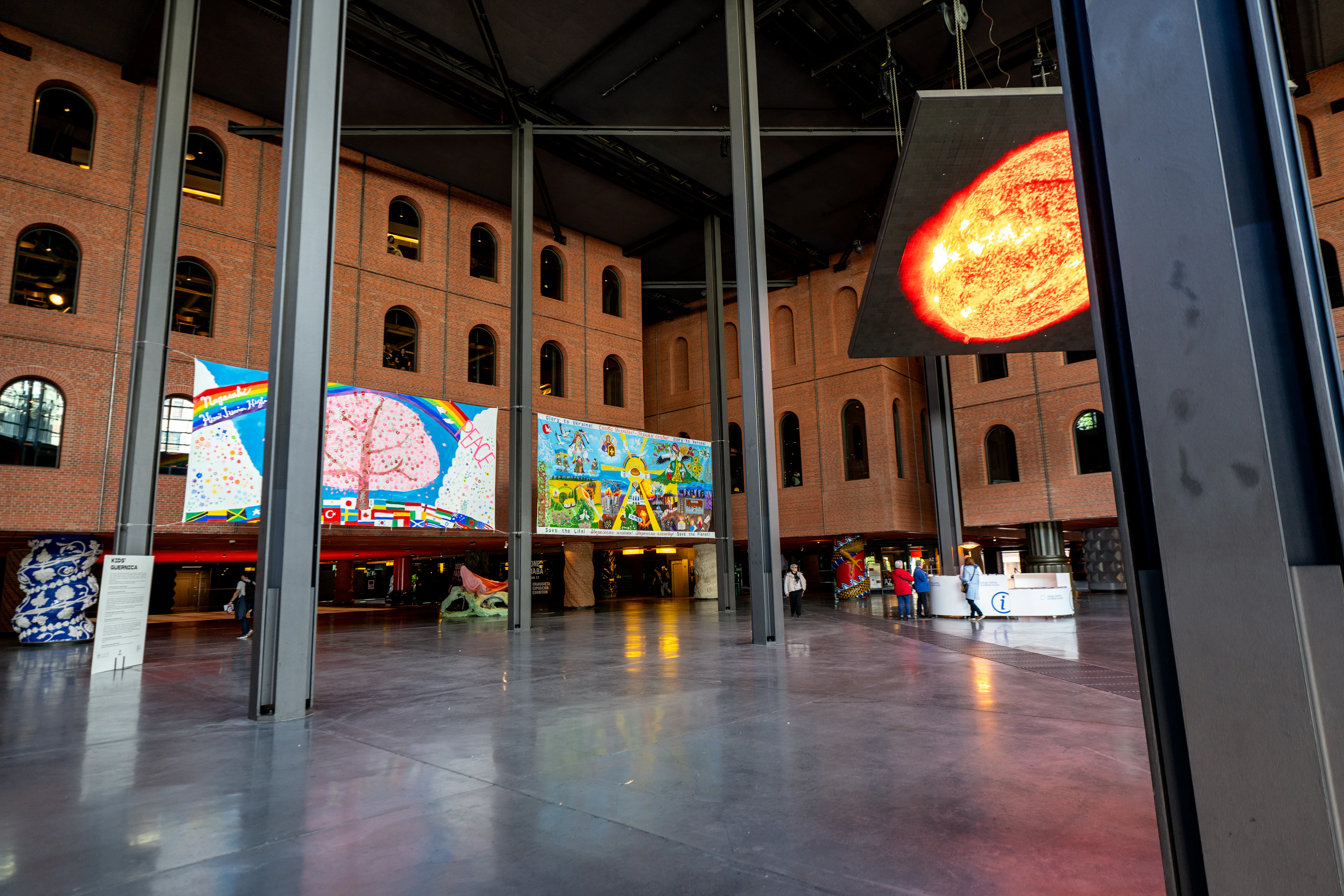 Modern art exhibition with colorful paintings on walls