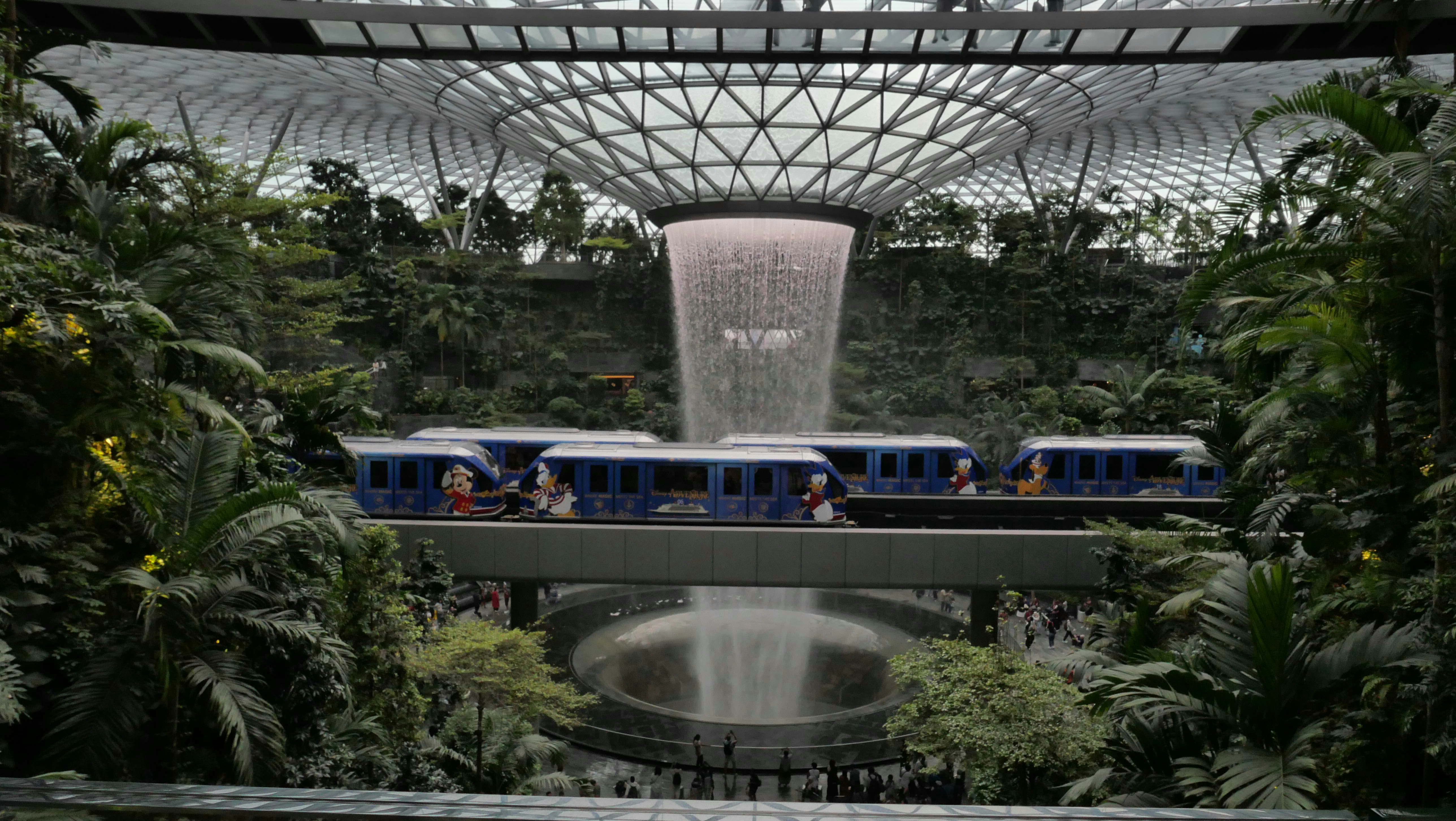 Monorail passing by the indoor waterfall at Jewel Changi Airport