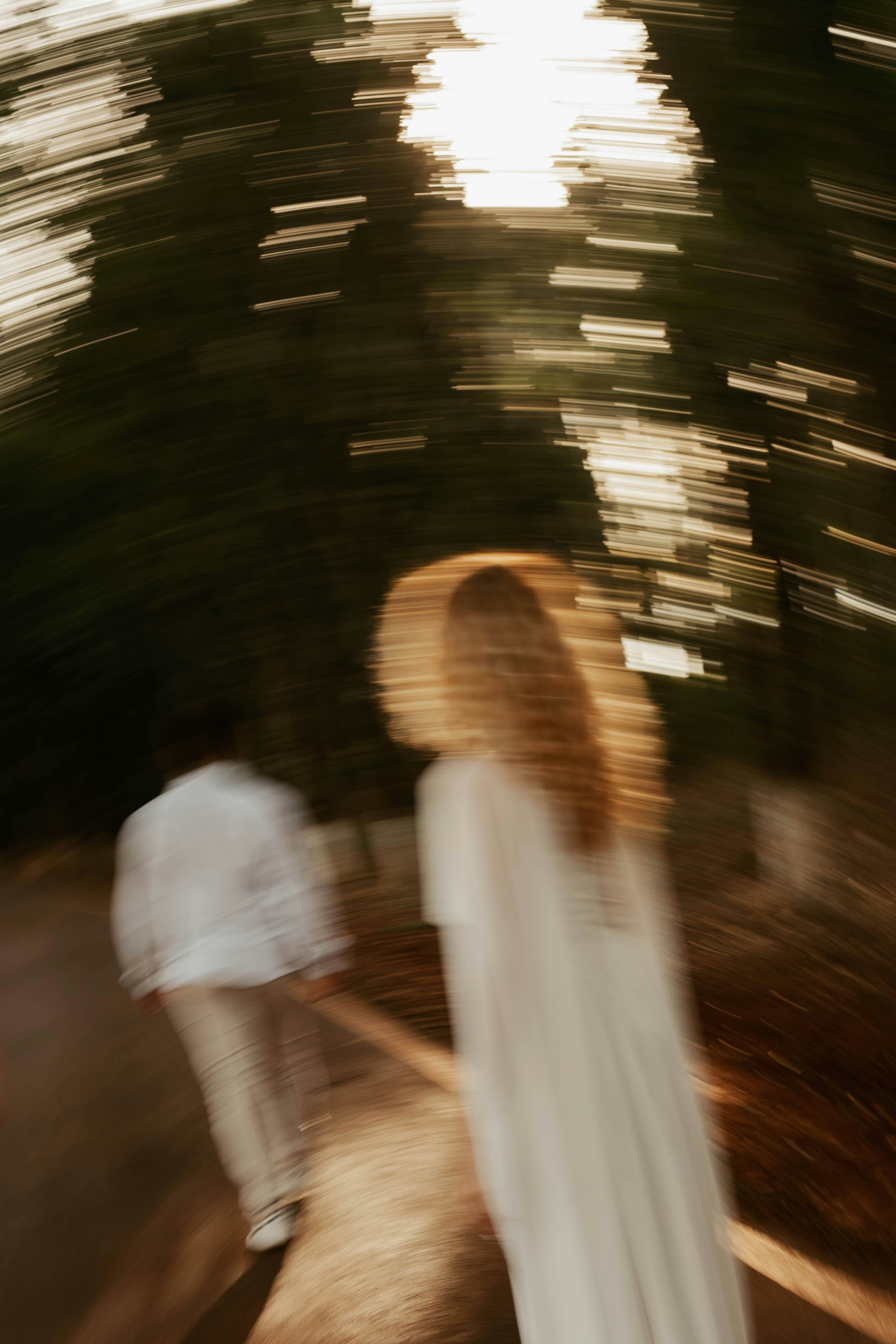 Two blurred figures walk away from the camera.