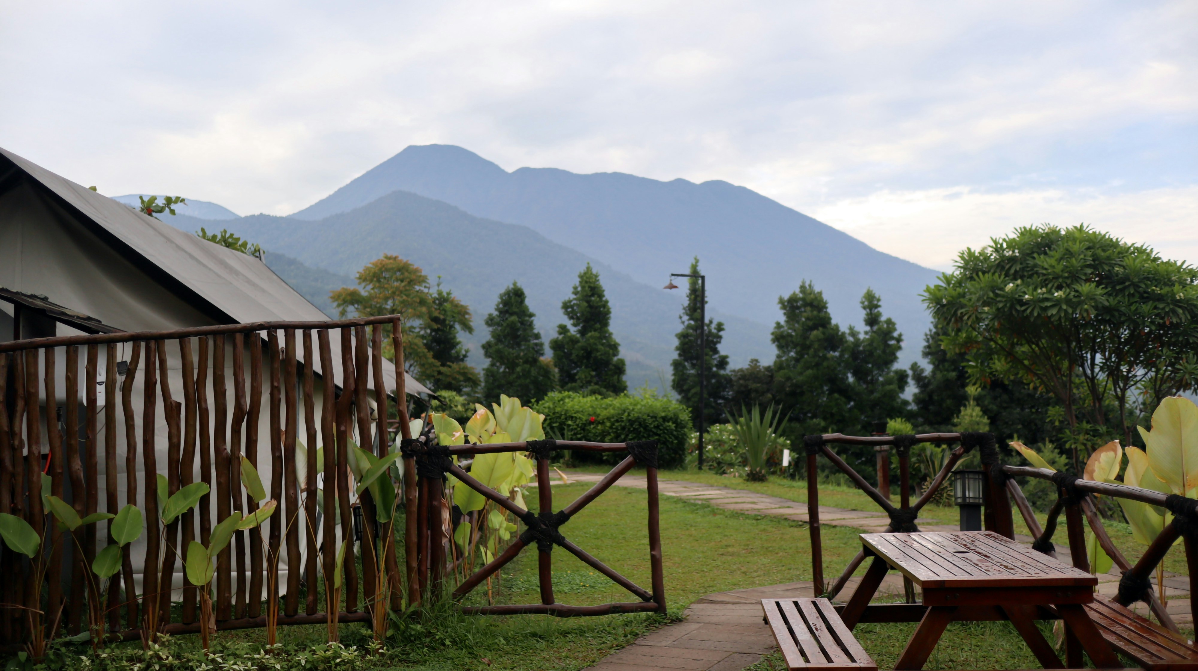 Rustic wooden fence with mountains in the background