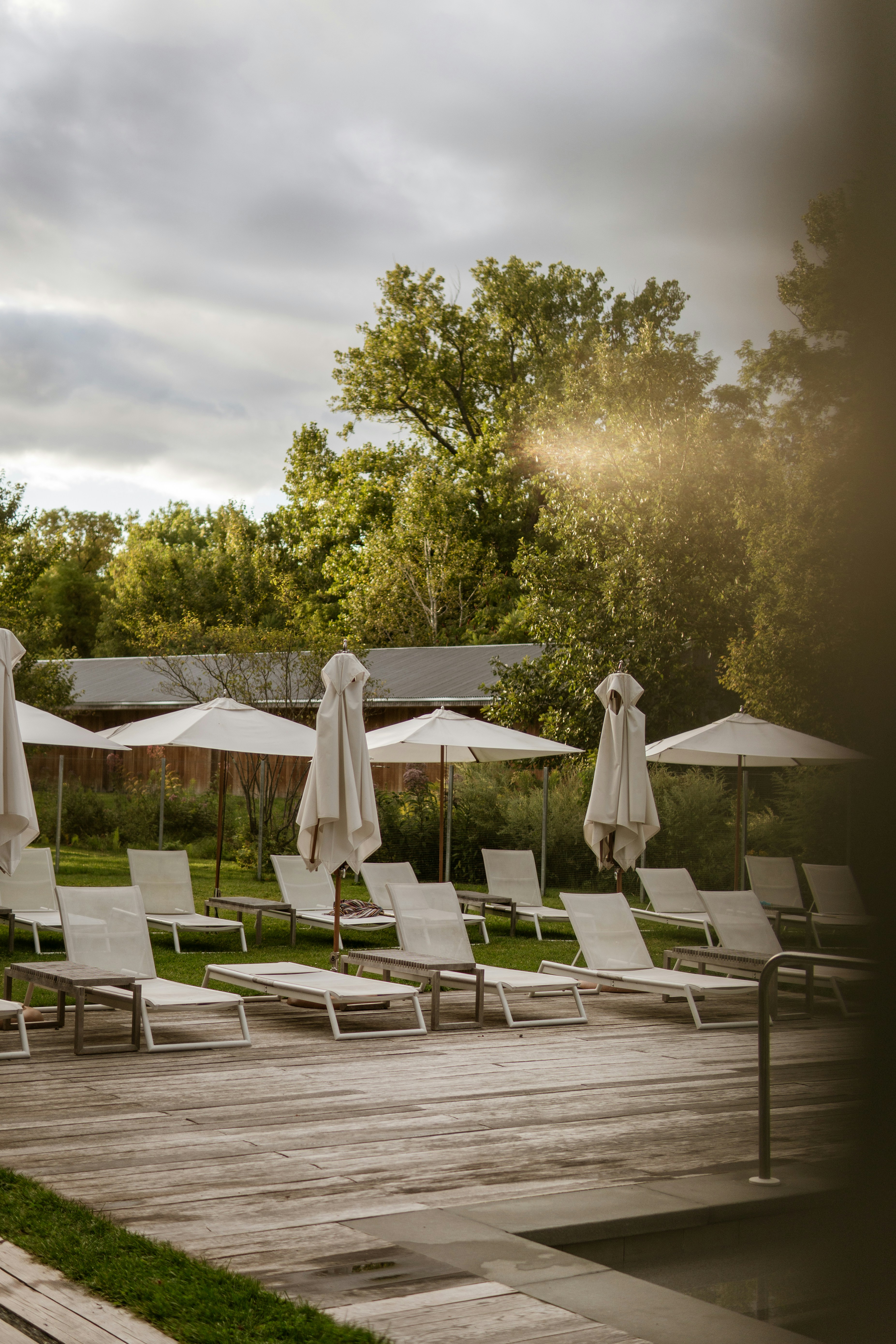 Lounge chairs and umbrellas on a wooden deck