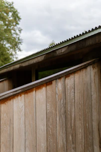 Weathered wooden wall and corrugated metal roof