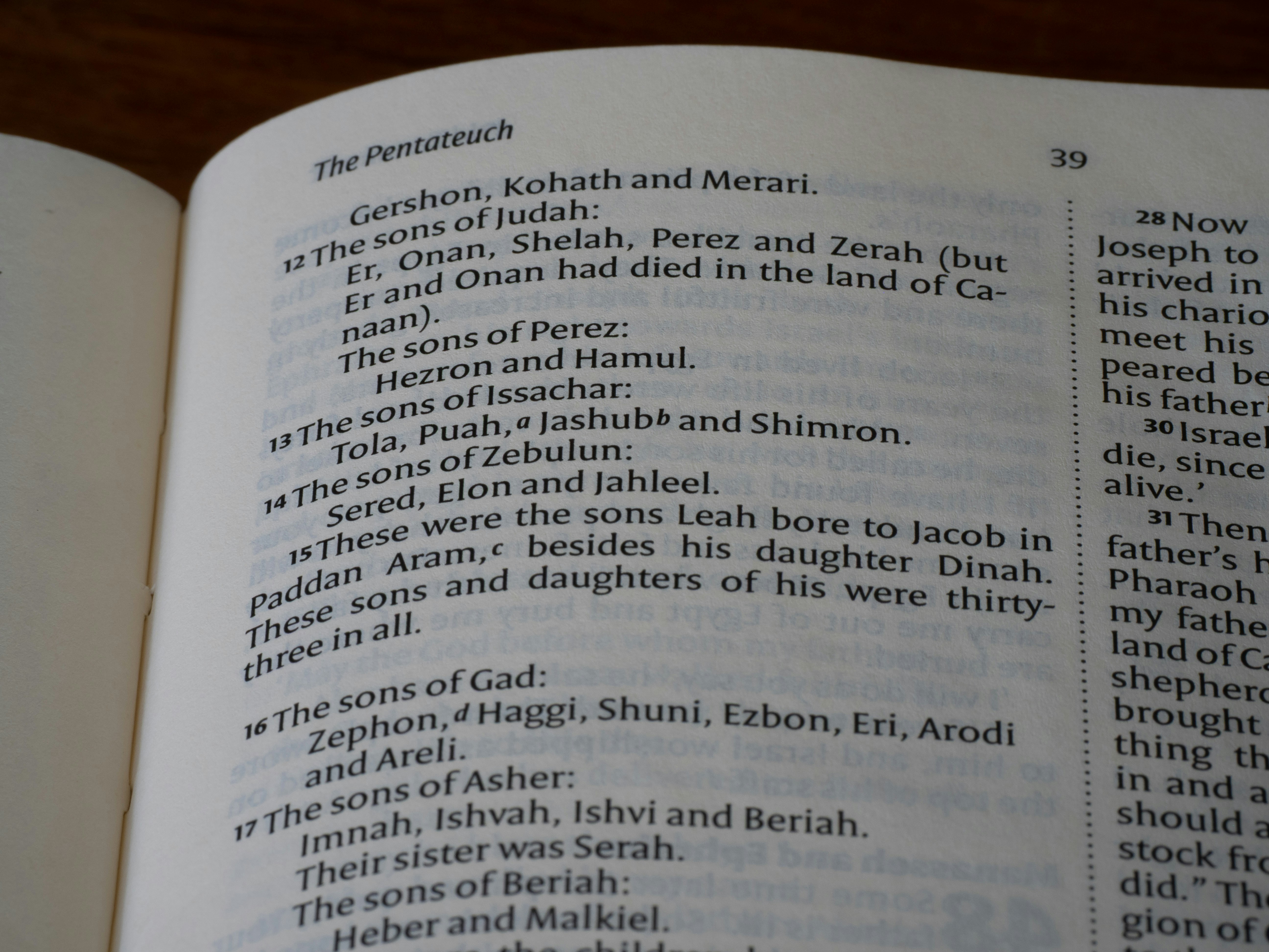 Close-up of an open book with text on pages.