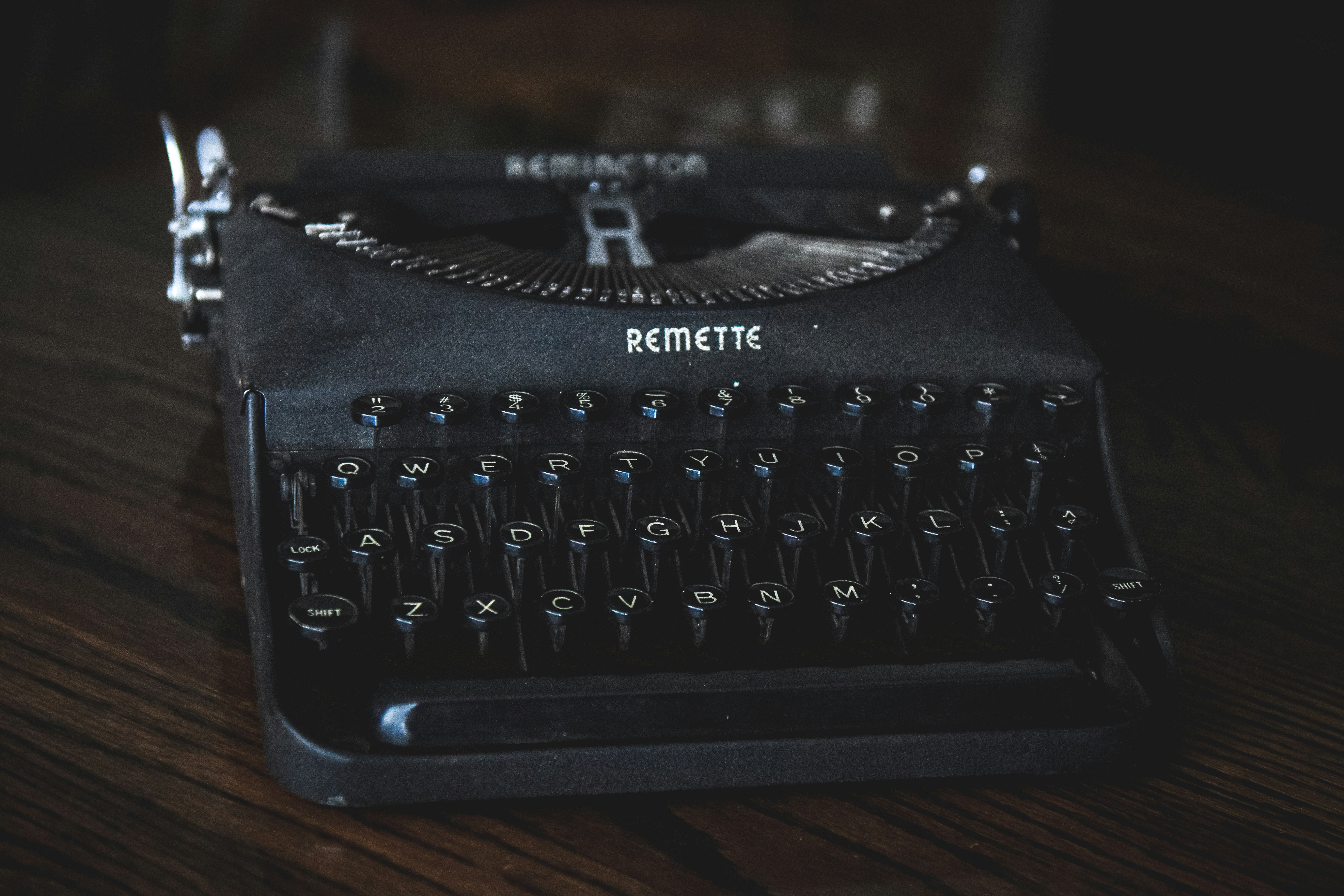 A vintage remington typewriter on a wooden surface