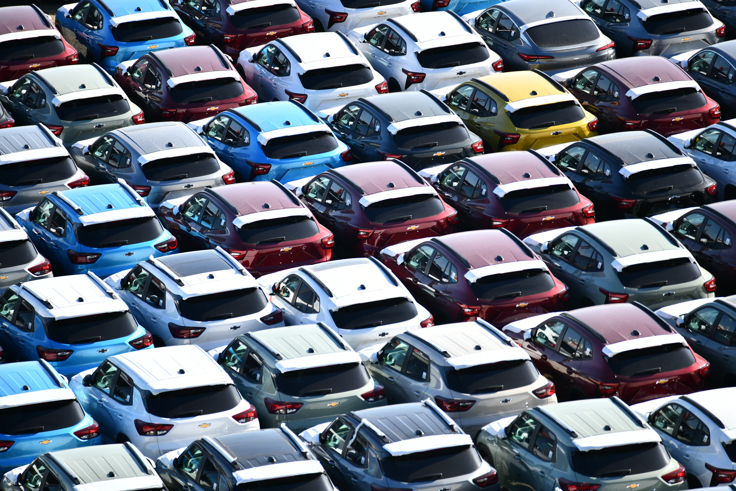 Rows of used cars at a vehicle marshalling yard
