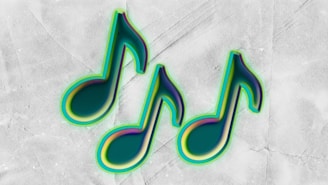 Three green musical notes on a textured background