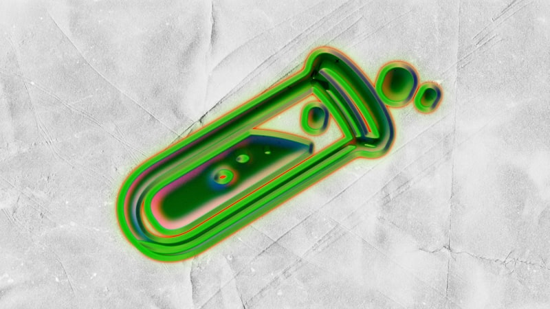 A green laboratory flask with bubbling liquid