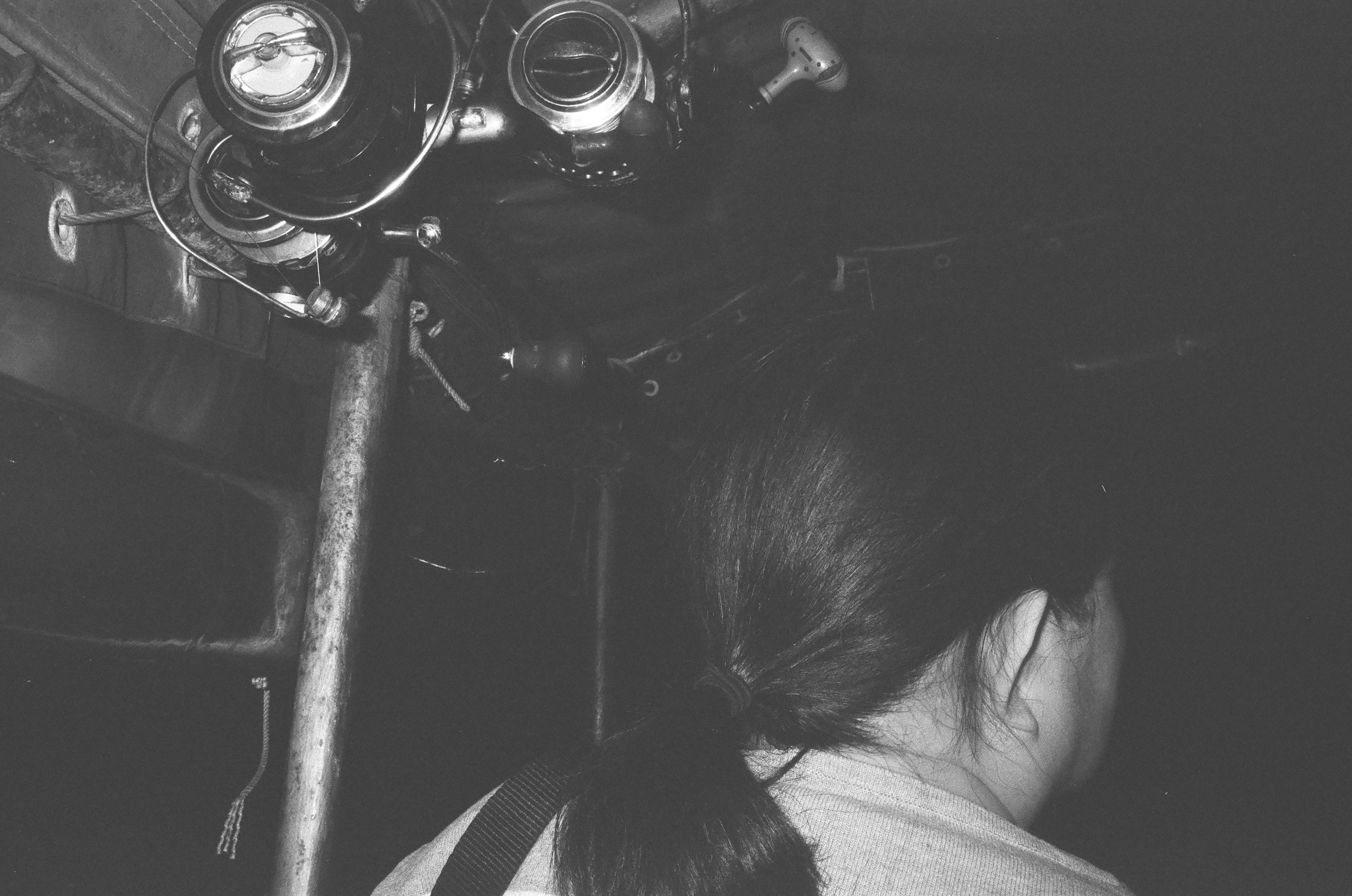 Woman looking into a vintage projector in-car entertainment system.