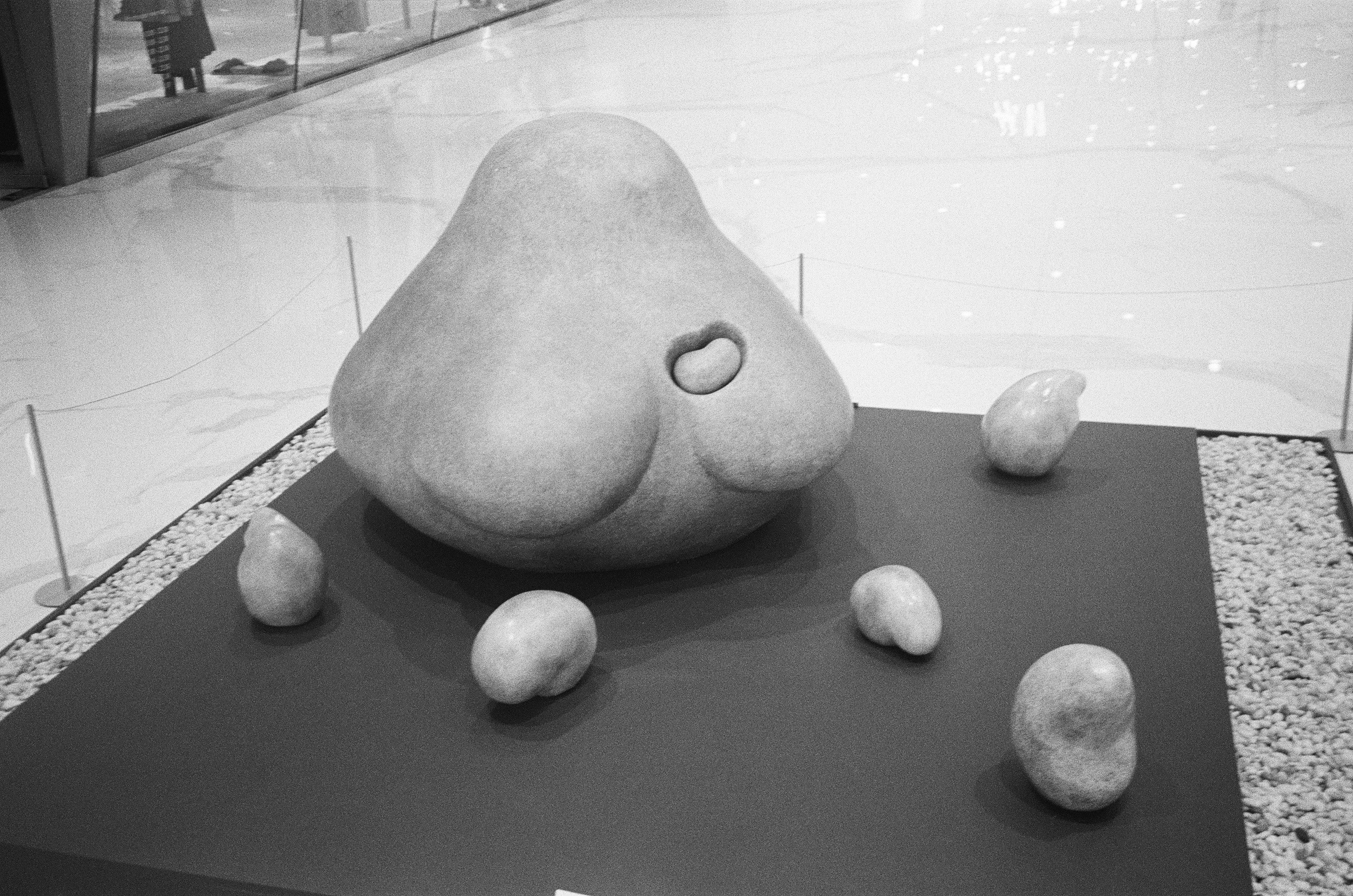 Abstract sculpture with surrounding smaller elements