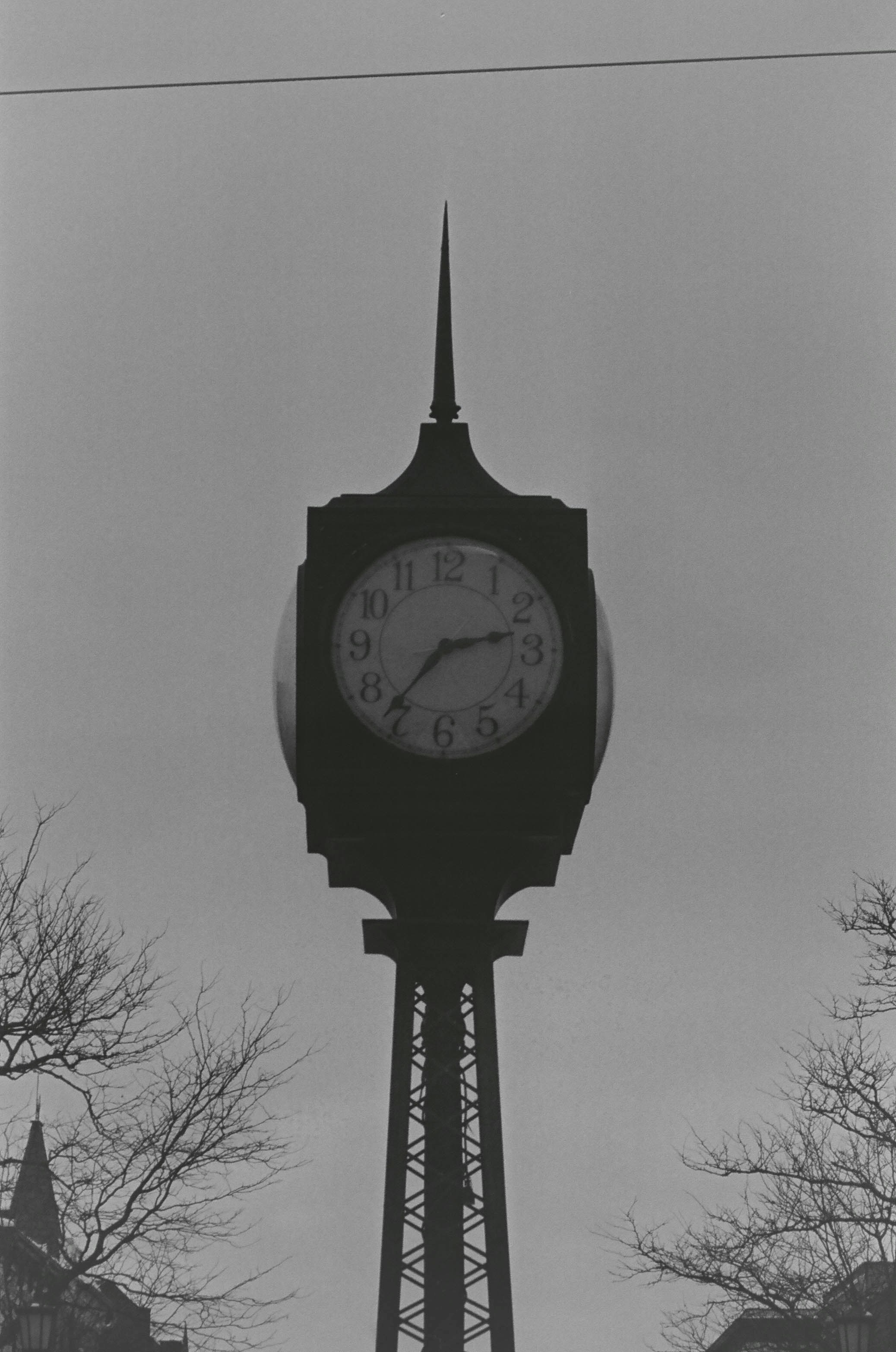 A tall clock tower against a cloudy sky.