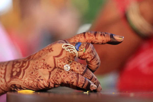 Hands with mehendi and rings