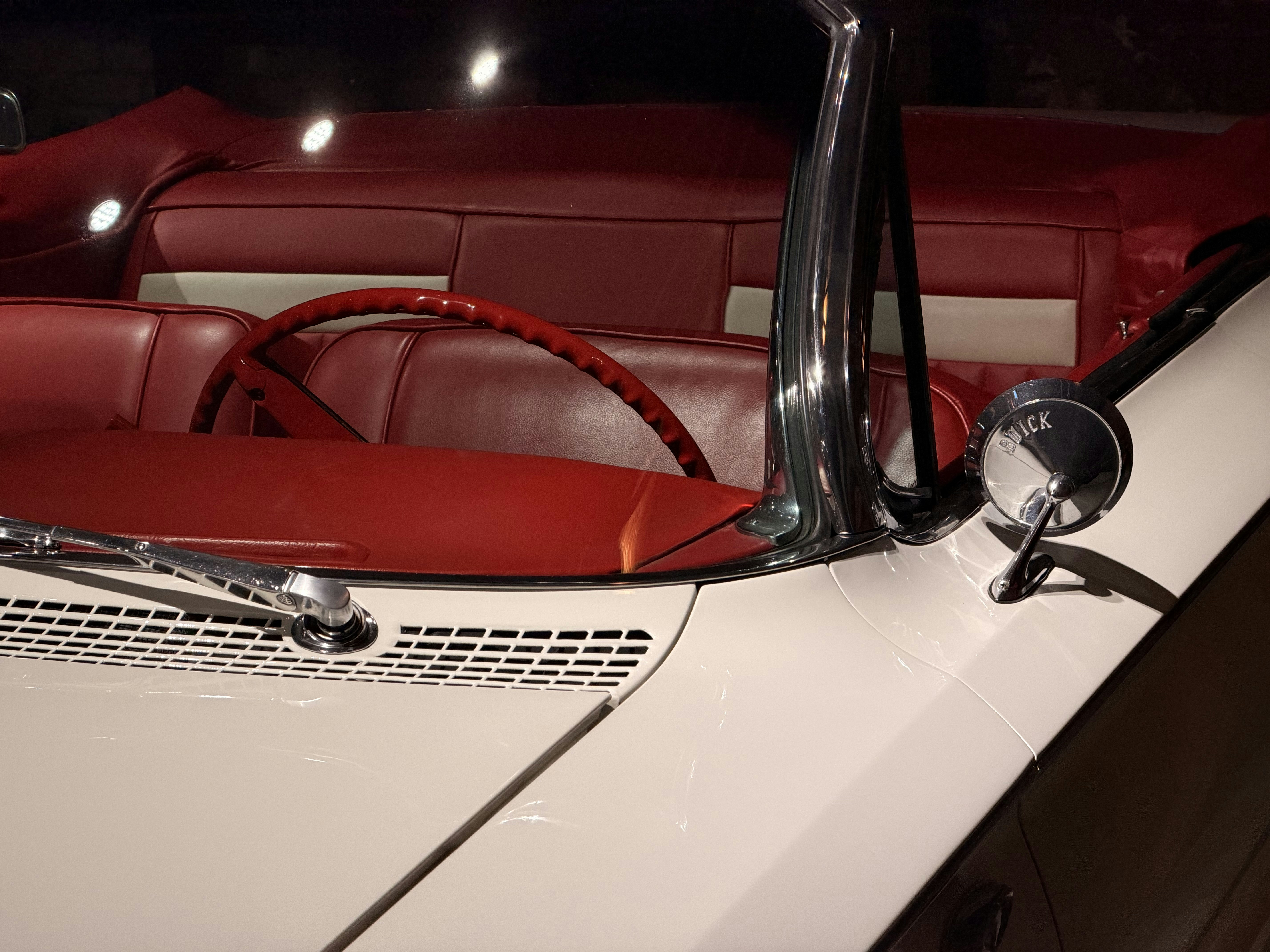Close-up of a vintage white convertible car interior.