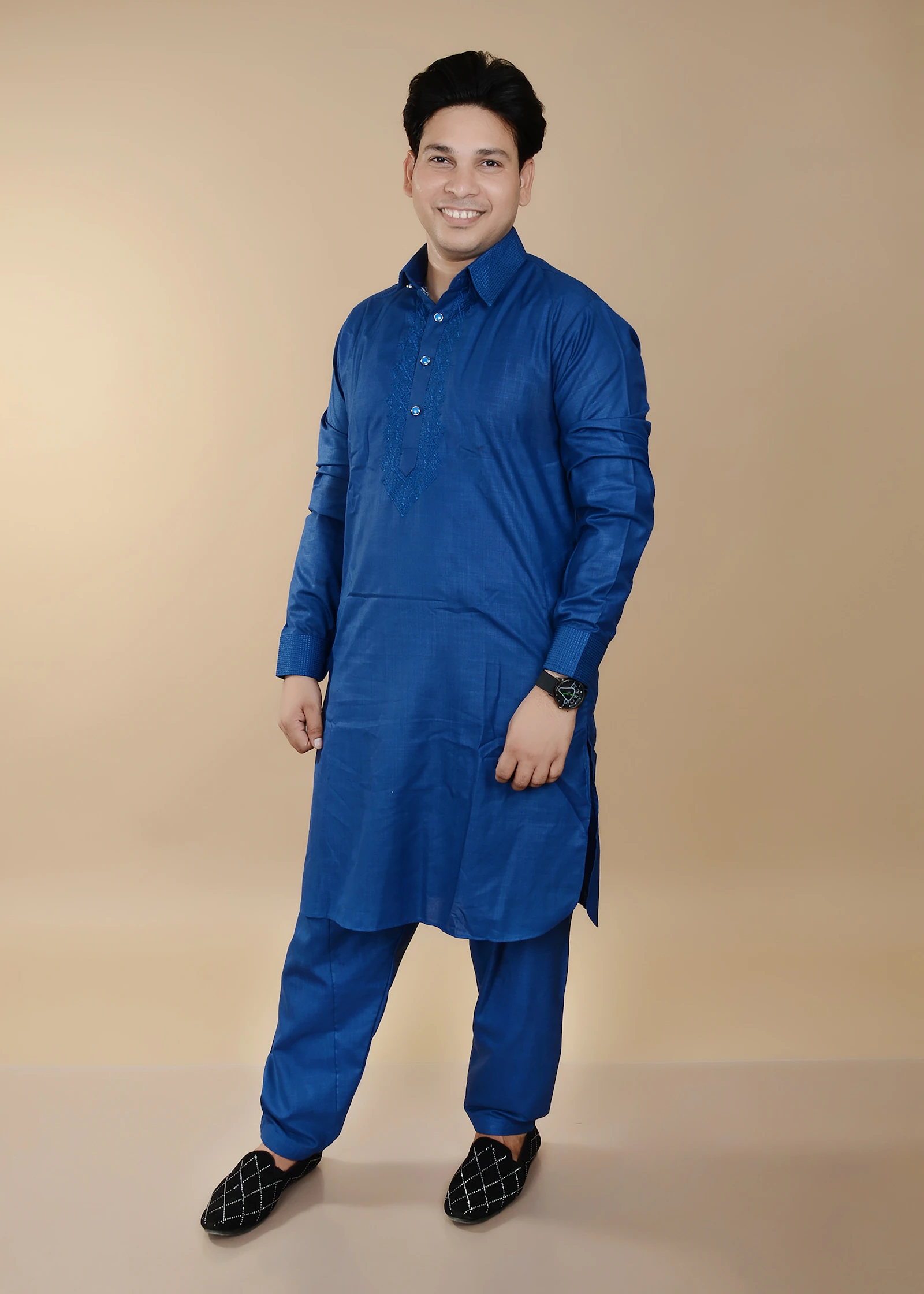 Man in blue kurta pajama, studio