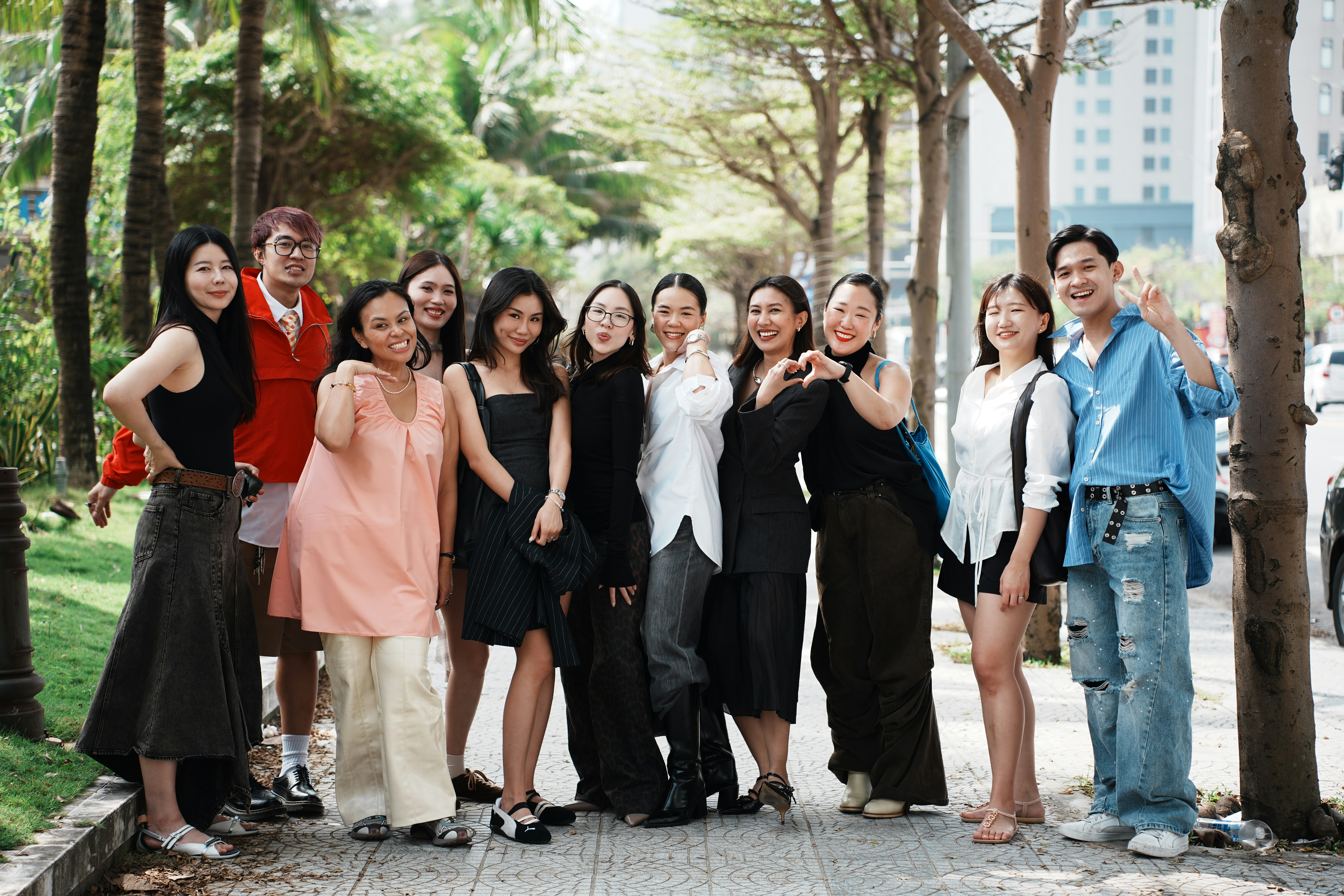A group of friends posing for a photo outdoors.