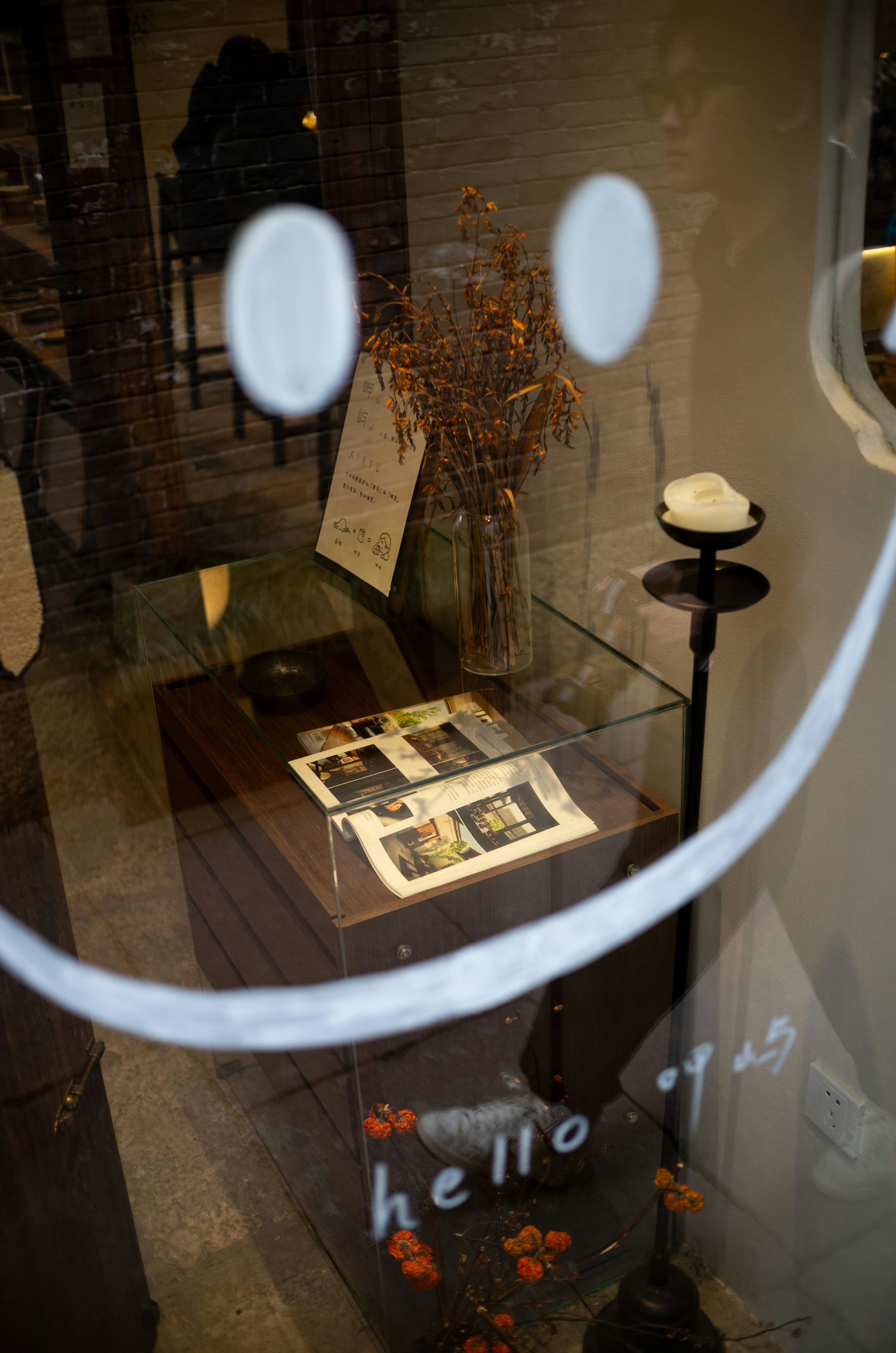 Smiley face drawn on glass with interior display visible